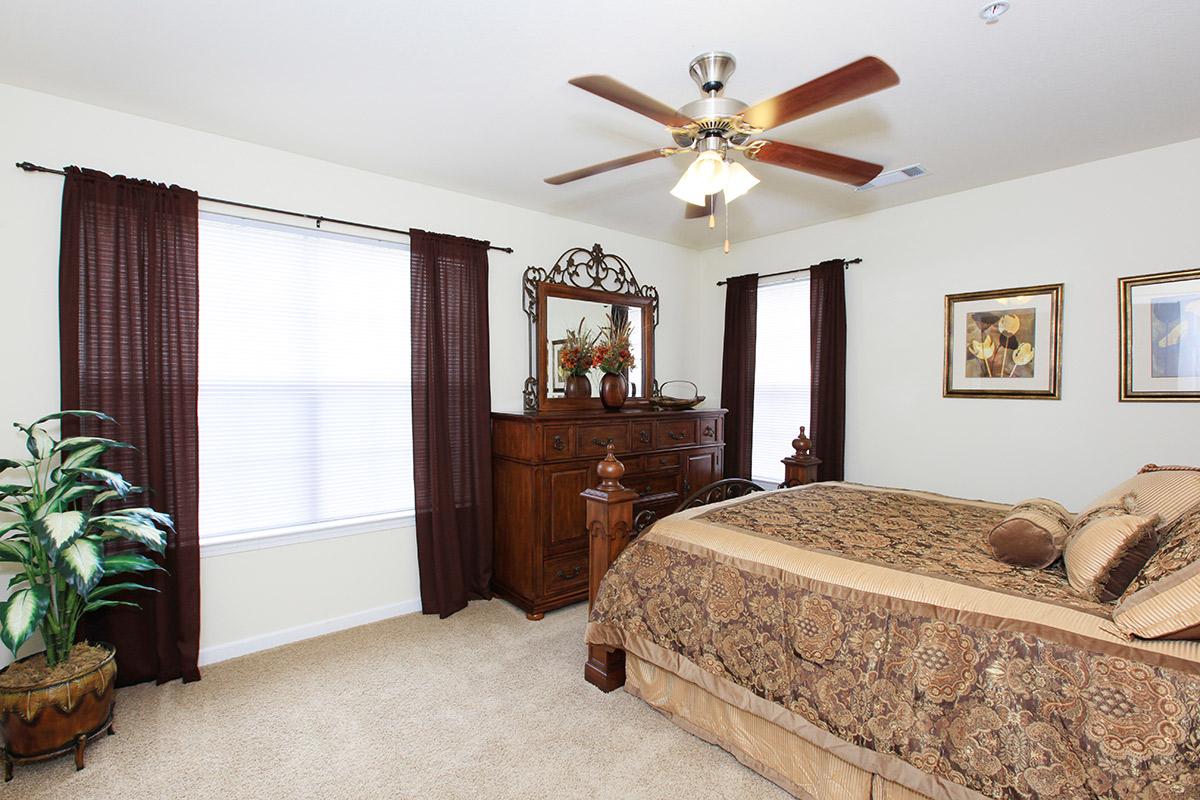 a bedroom with a large bed in a room