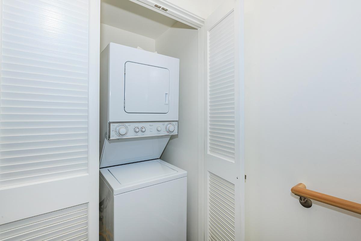 a white sink sitting under a window