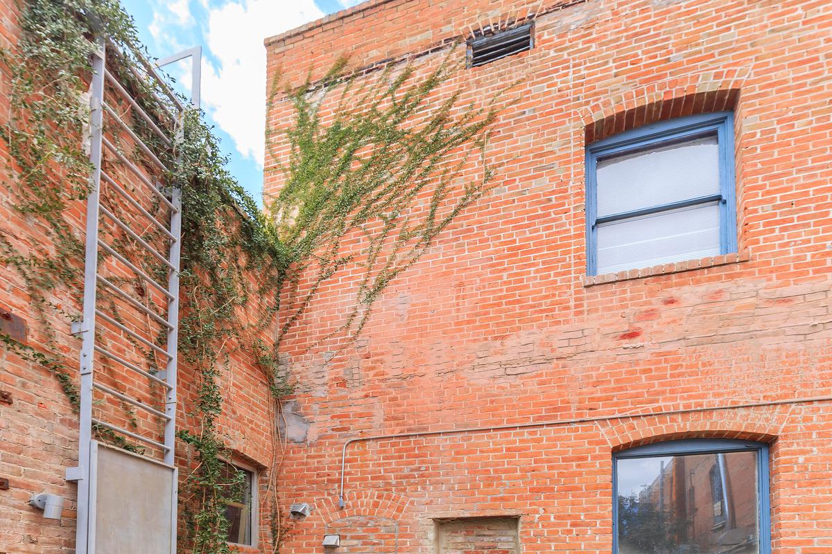 a close up of a red brick building