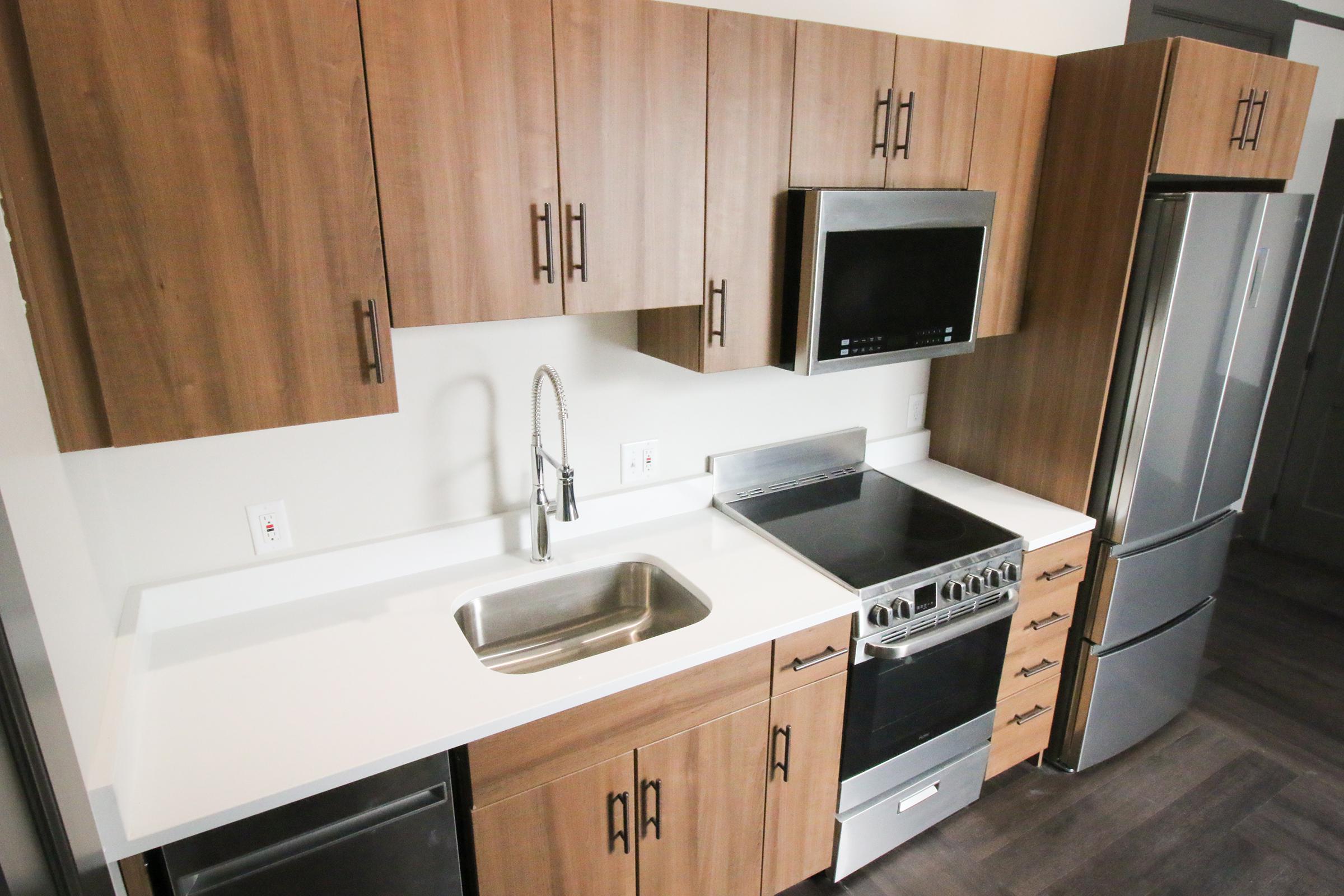 a kitchen with a sink and a microwave