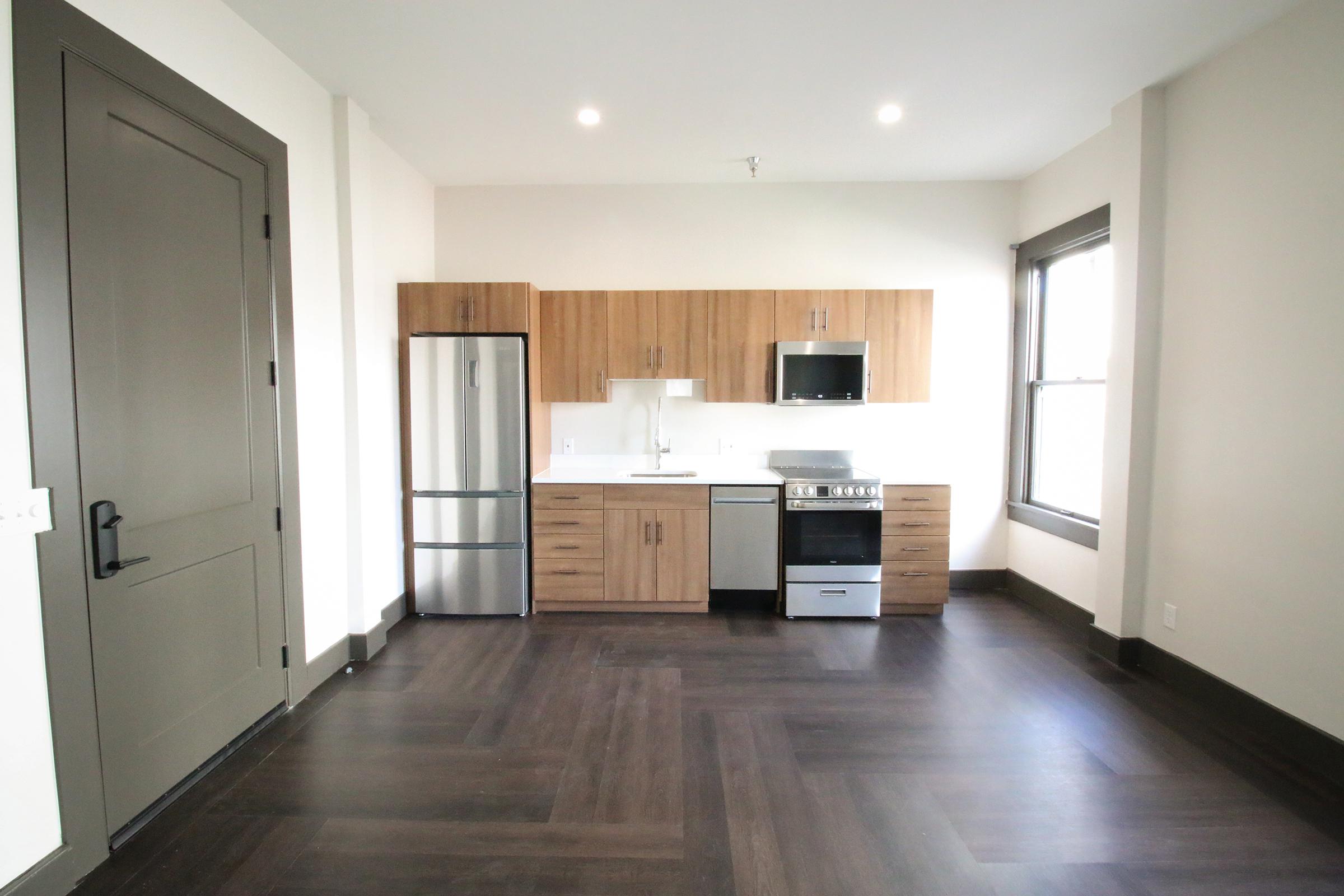 a kitchen with a wood floor