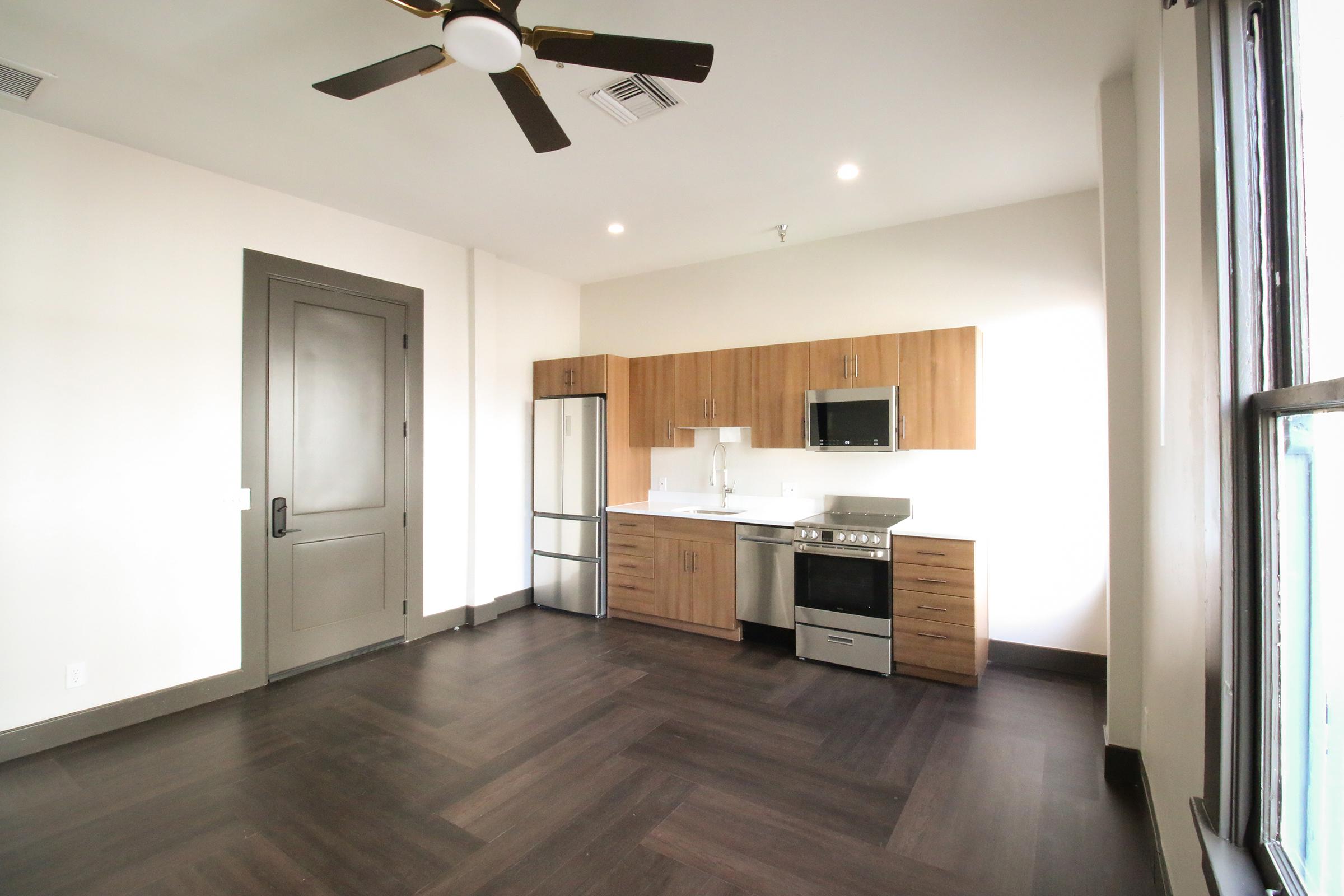 a kitchen area with a building in the background