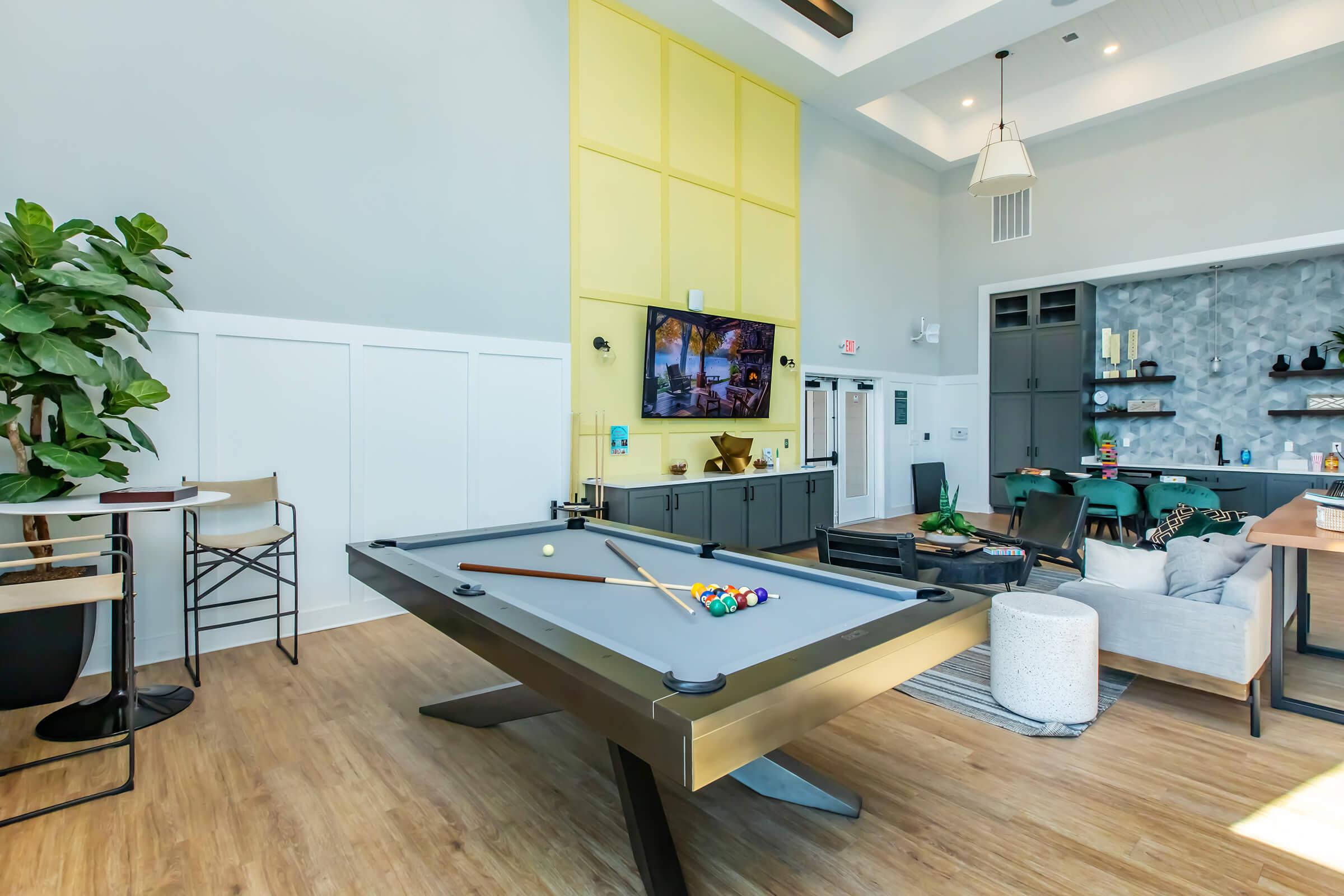 a kitchen with a dining room table