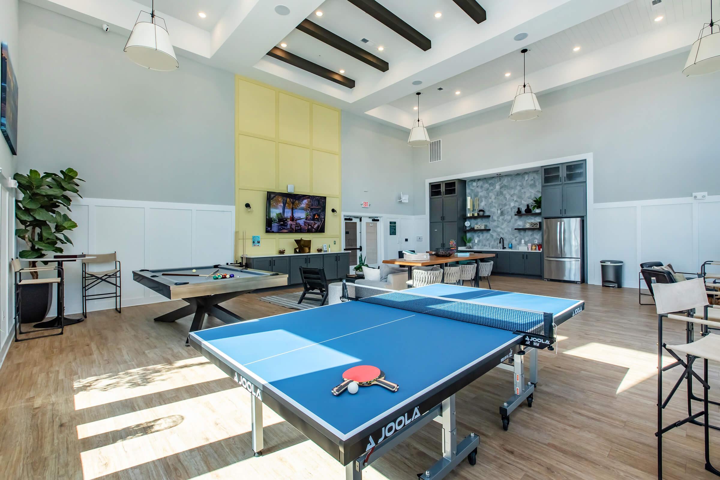 a kitchen with a blue chair