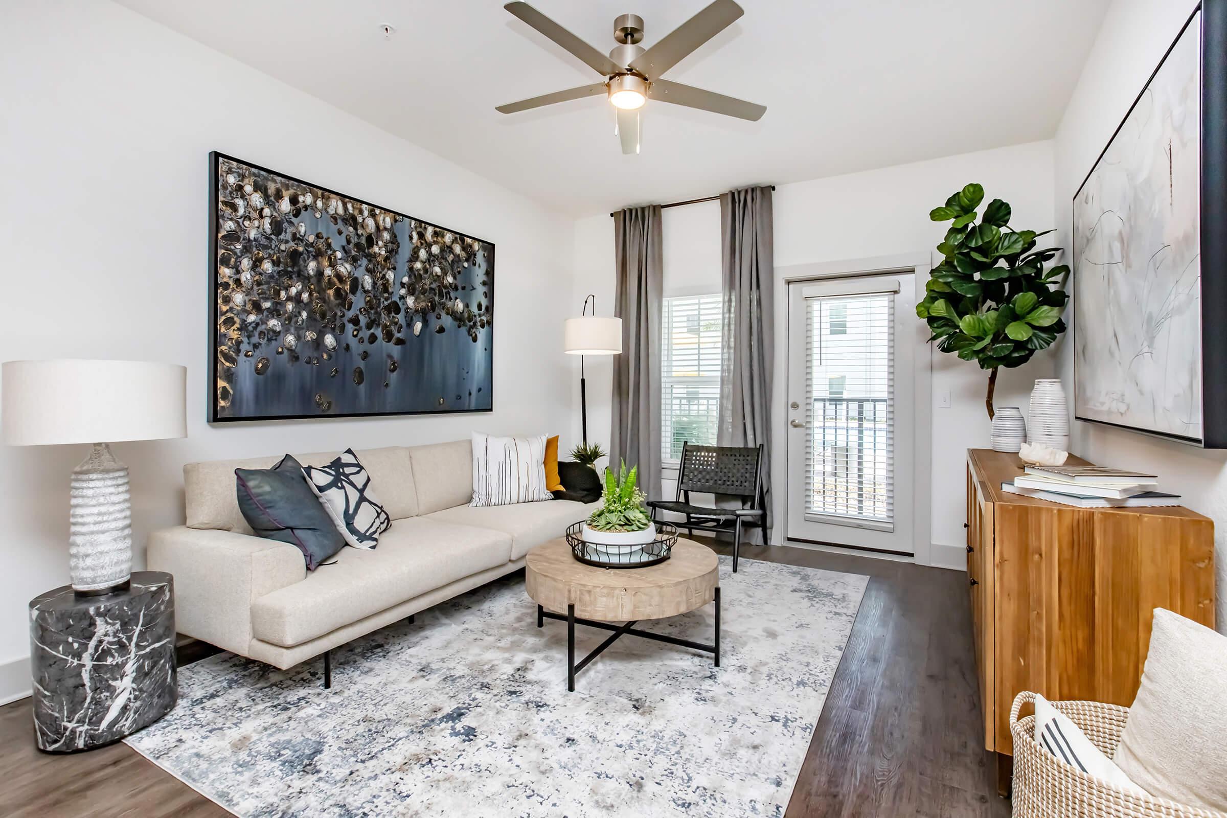 a living room filled with furniture and a fire place