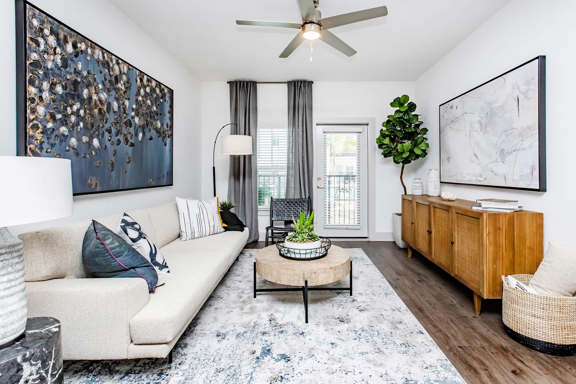 a living room filled with furniture and a fireplace