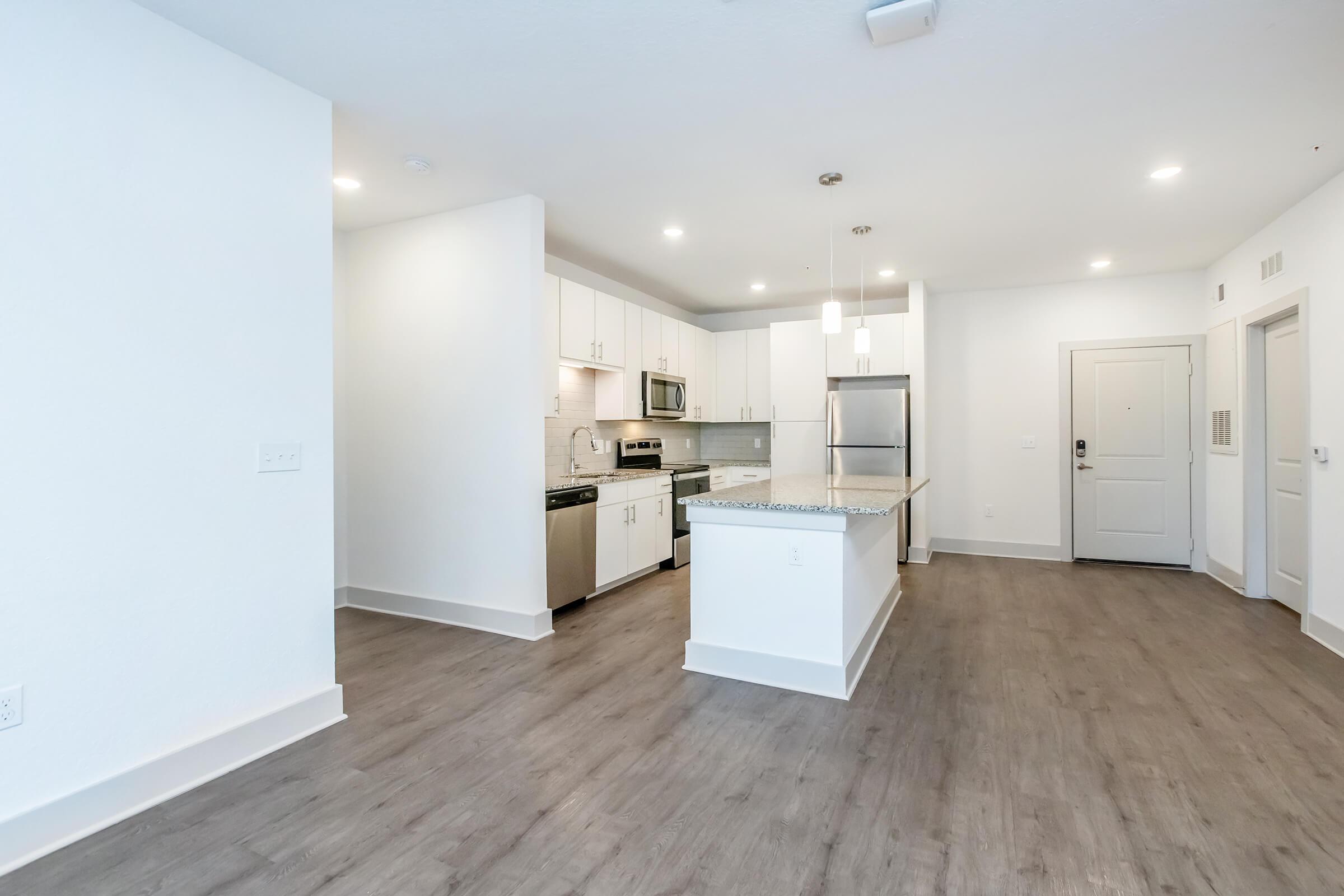 a kitchen with a wooden floor