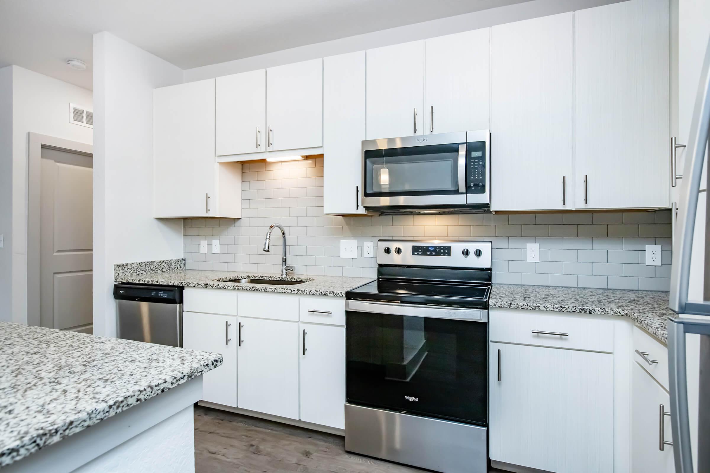 a kitchen with a stove and a sink