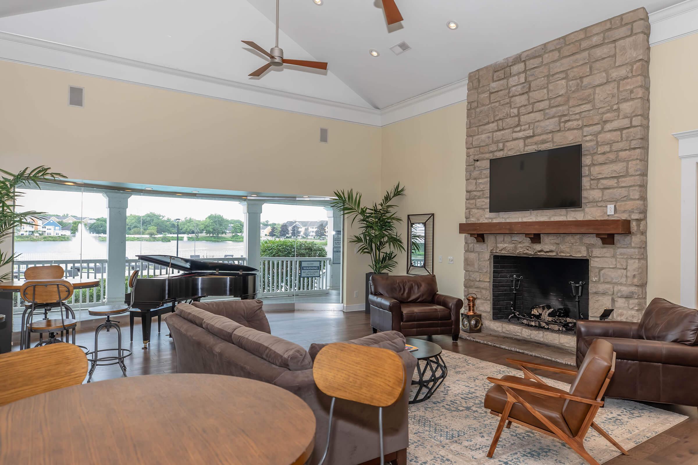 a living room filled with furniture and a fire place