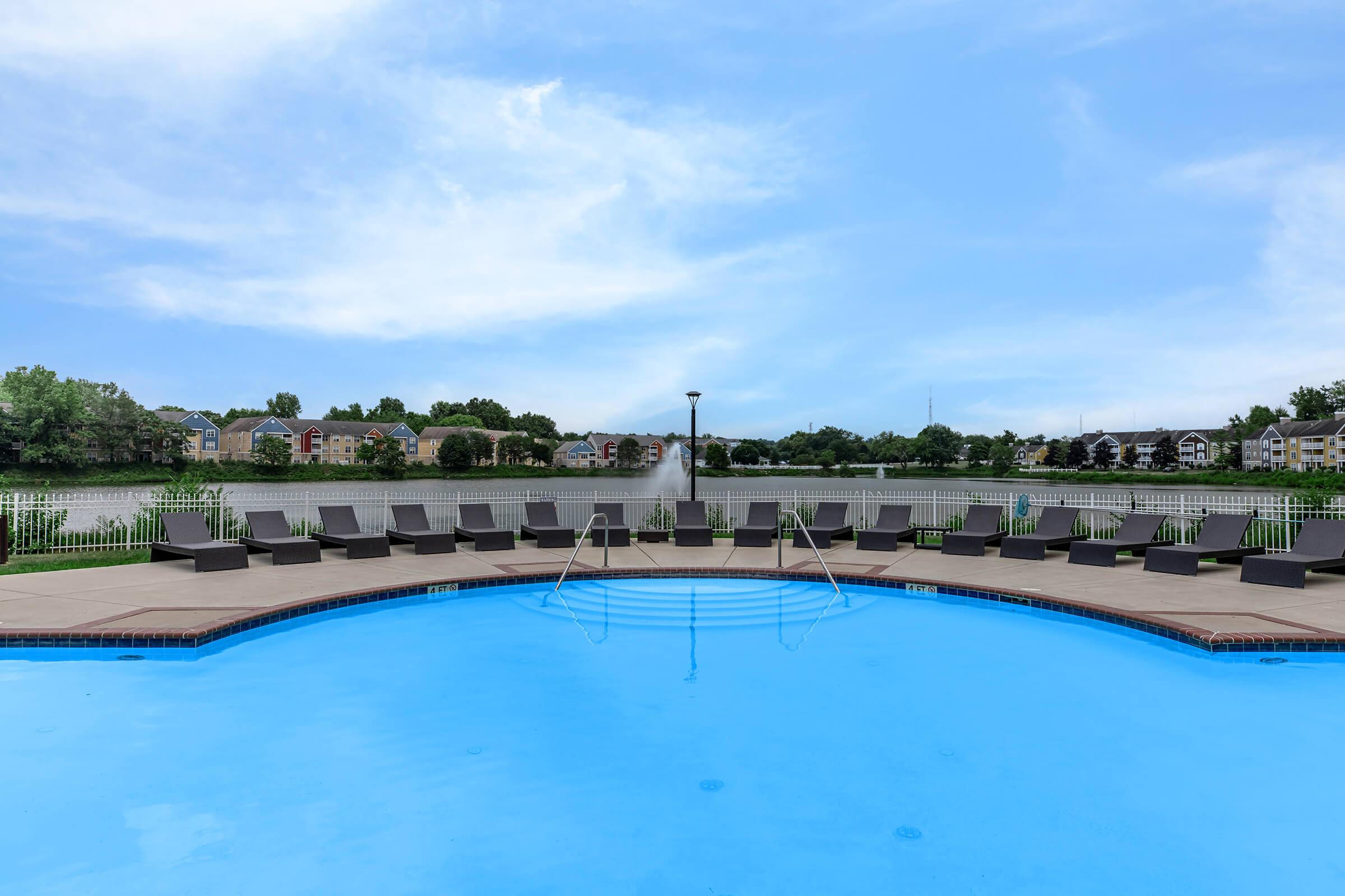 a pool next to a body of water