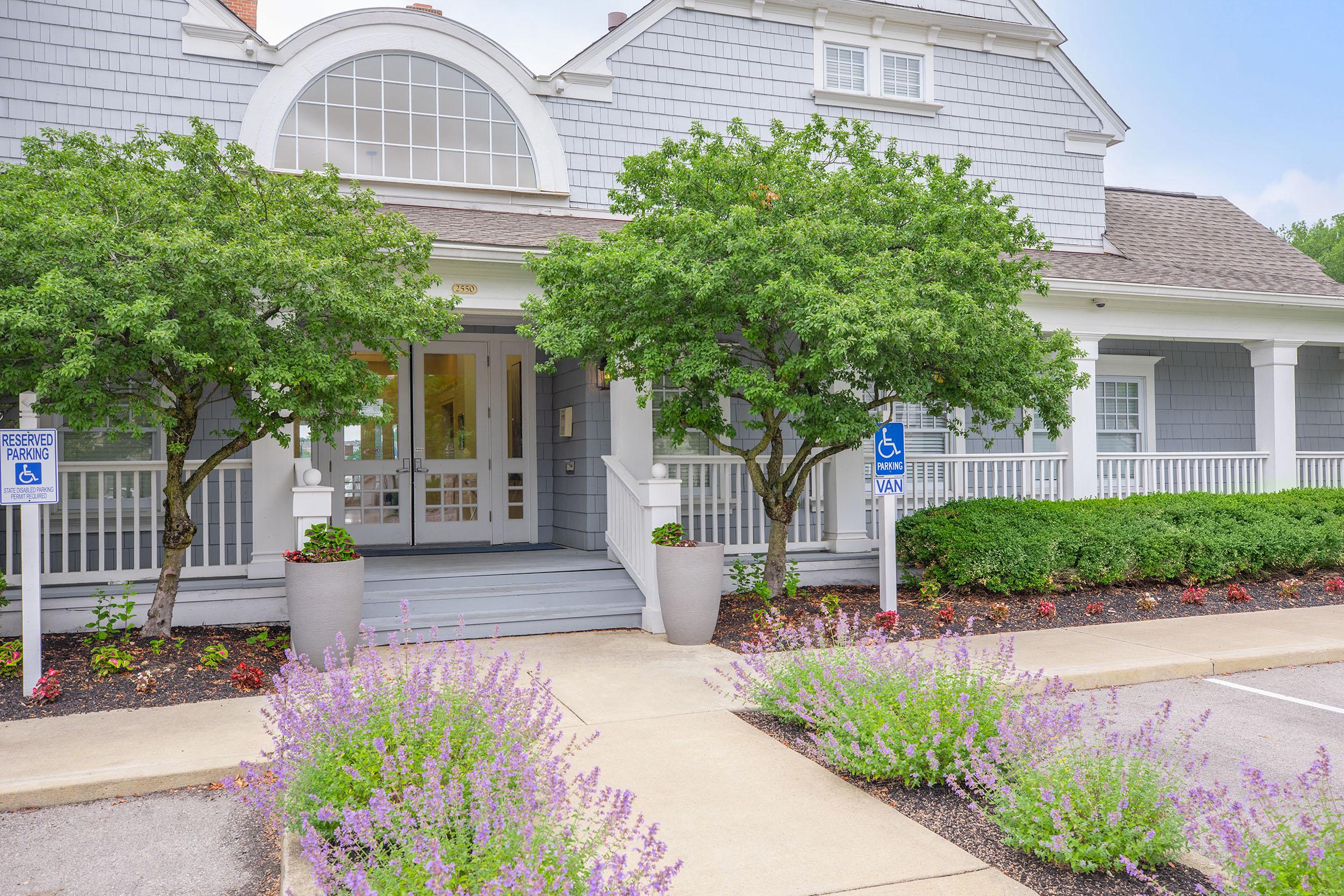 a close up of a flower garden in front of a building