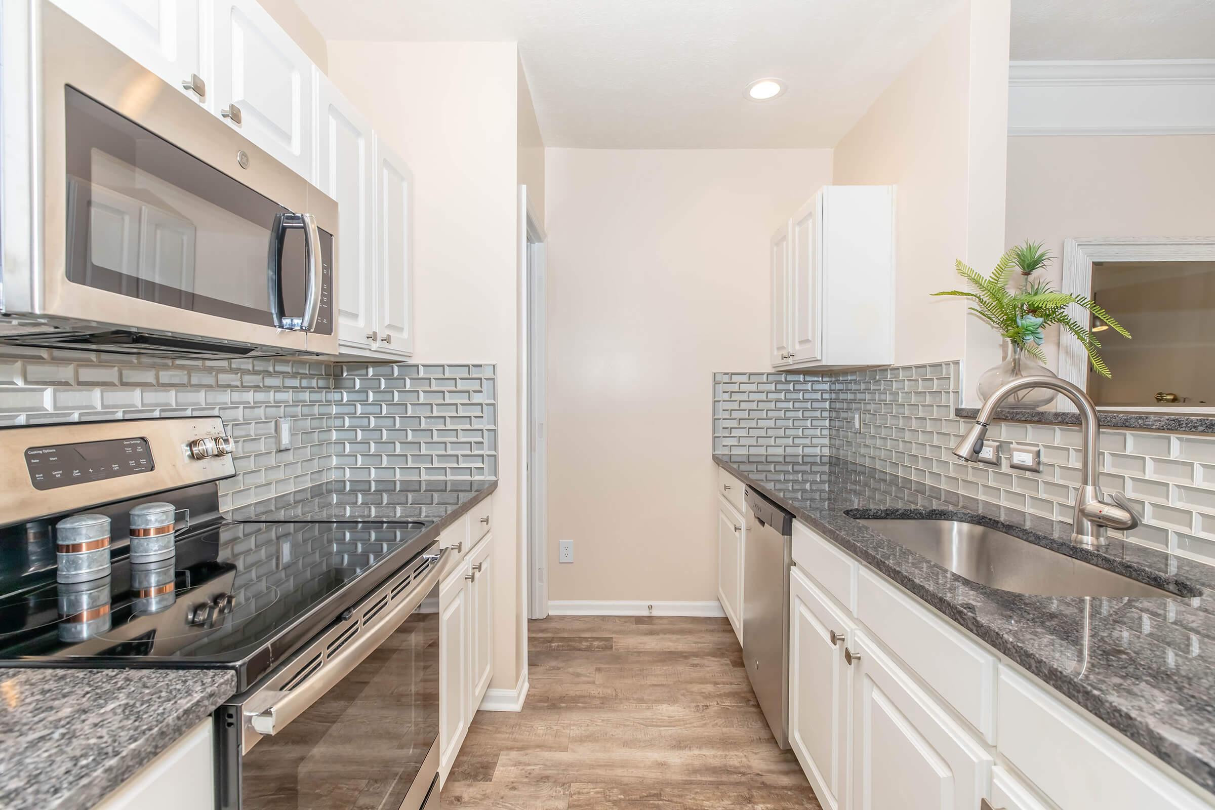 a modern kitchen with stainless steel appliances