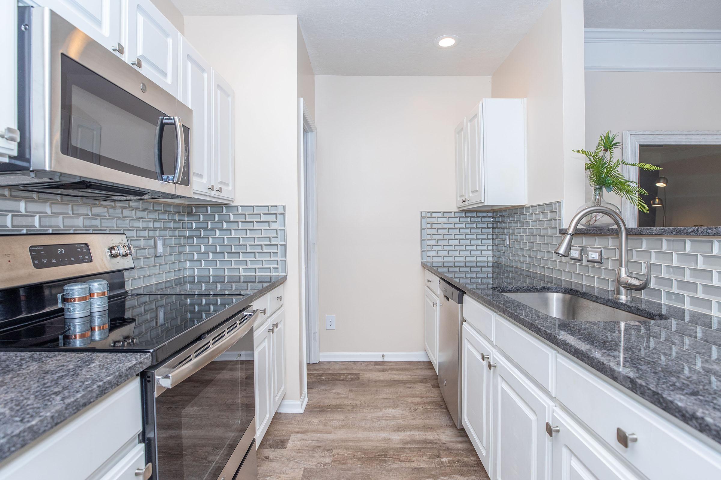 a modern kitchen with stainless steel appliances