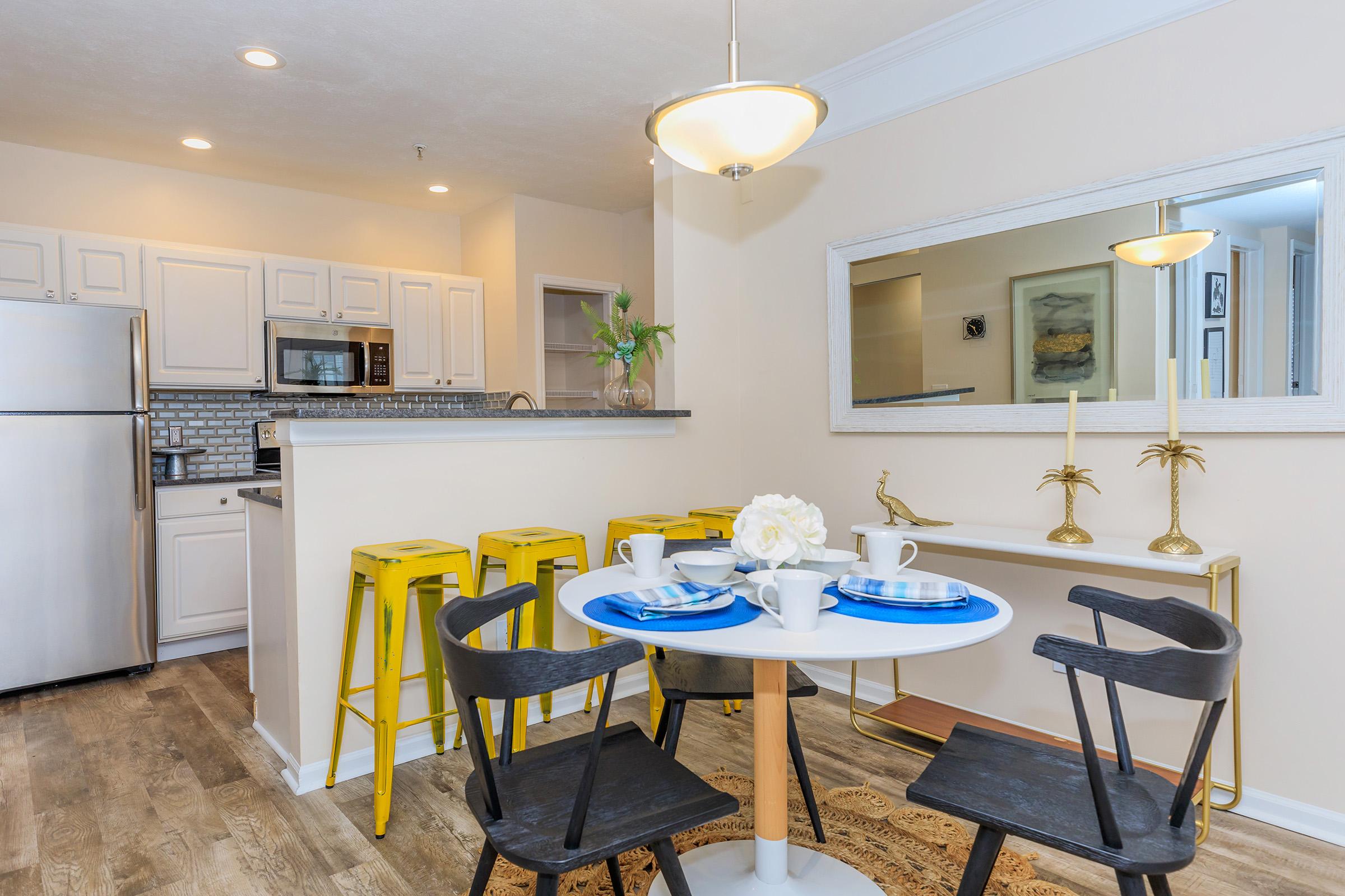 a kitchen with a dining room table