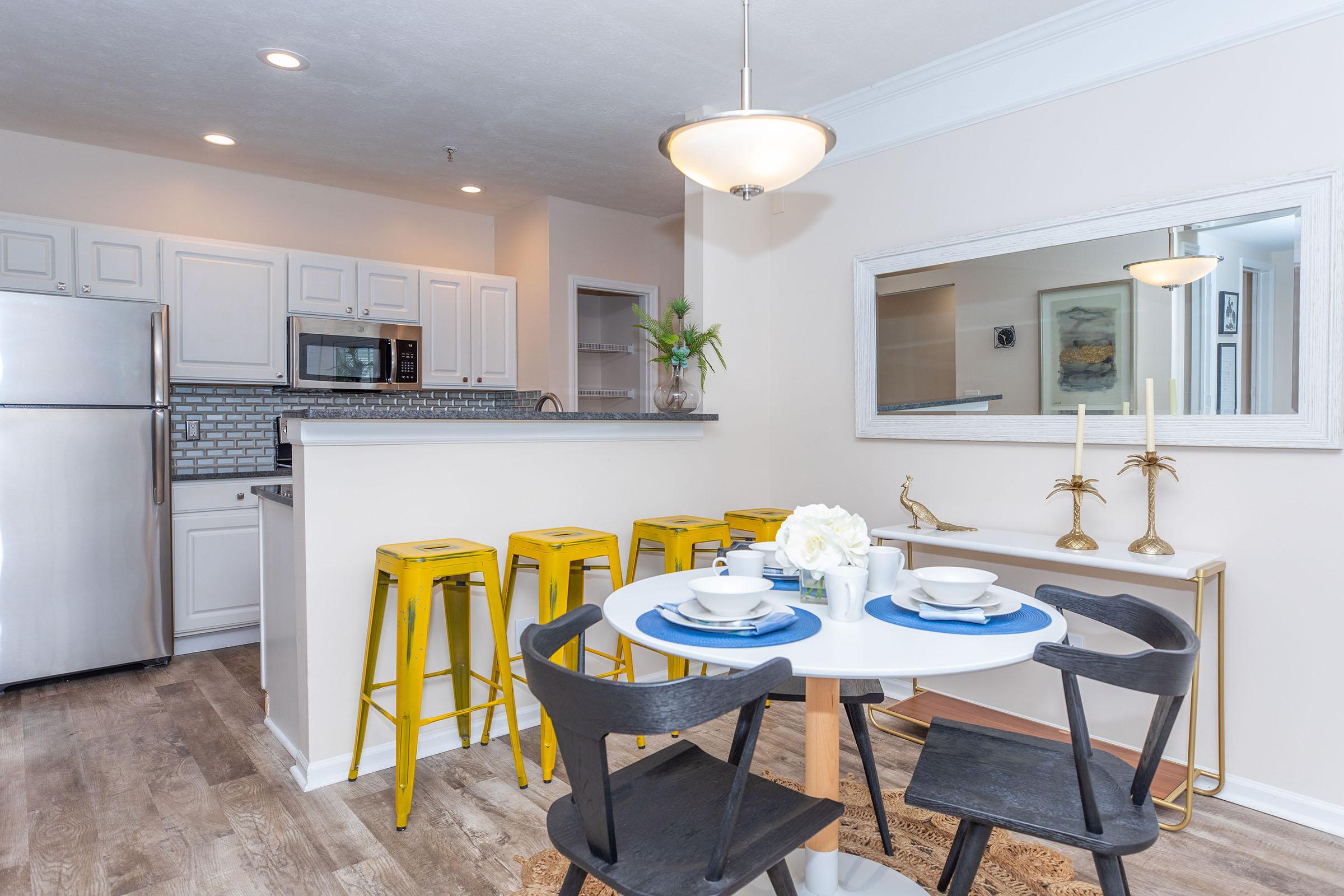 a kitchen with a dining room table