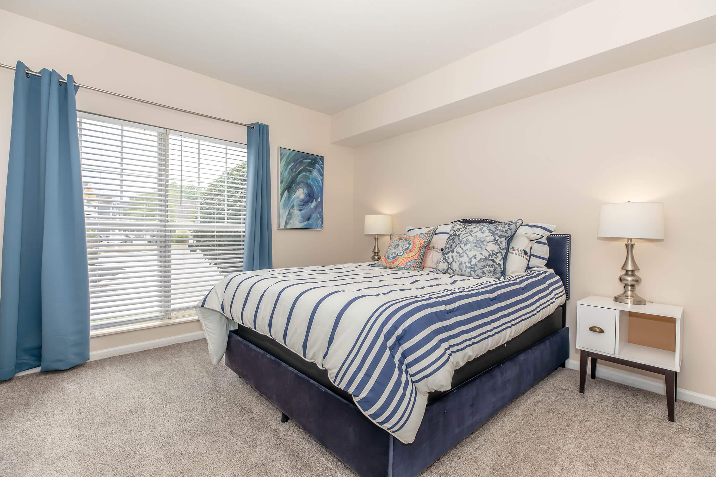 a bedroom with a bed in a hotel room