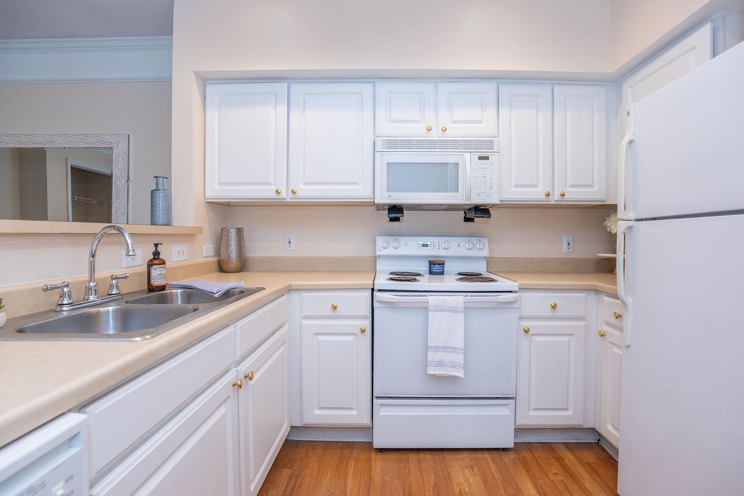 a kitchen with a sink and a microwave