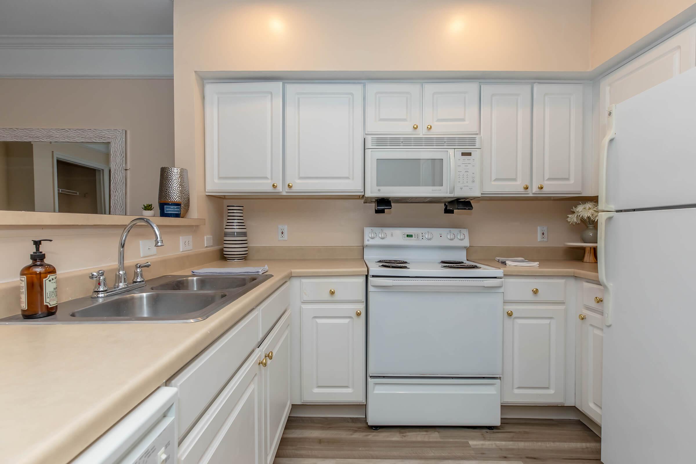 a kitchen with a sink and a microwave