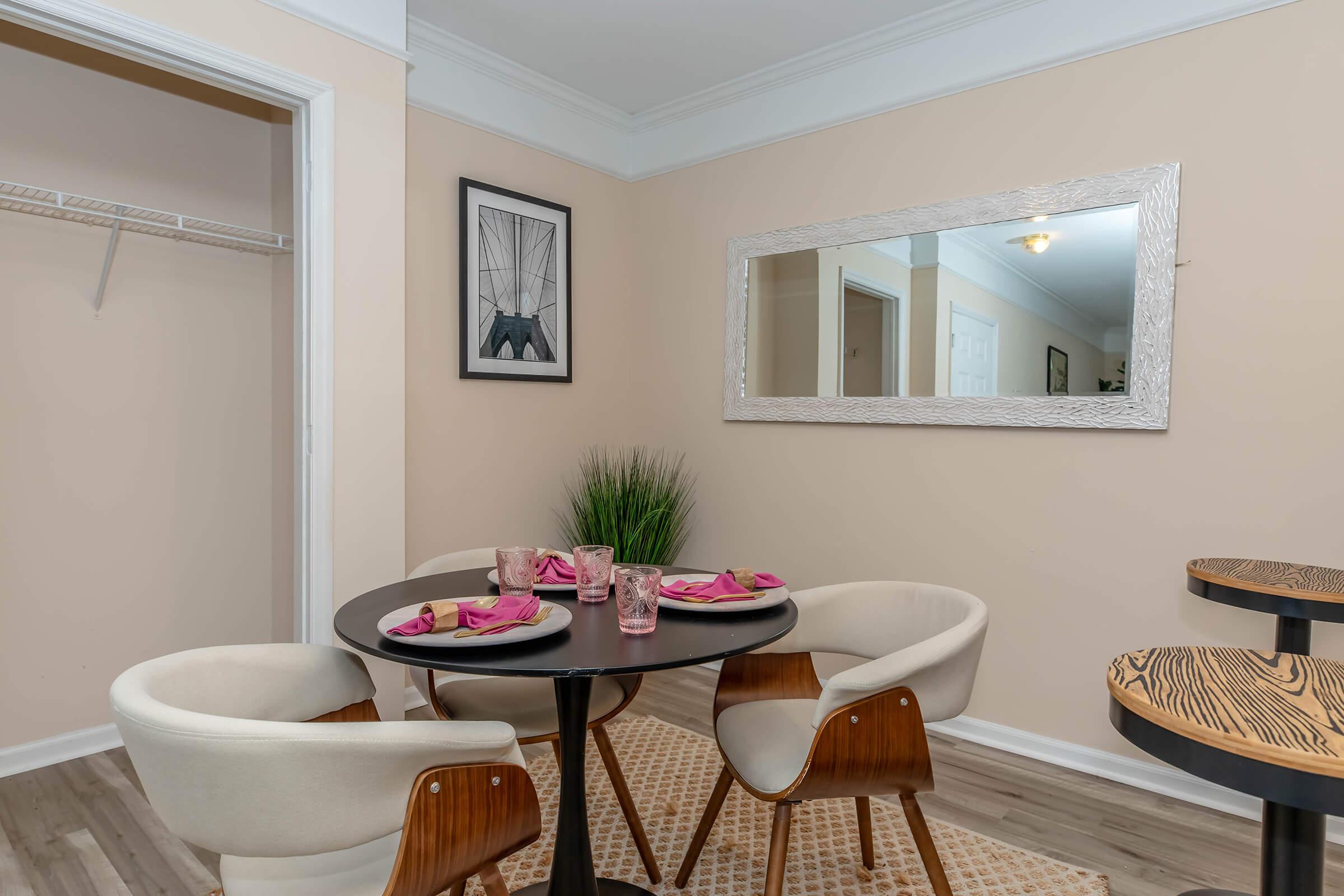 a living room filled with furniture and a table