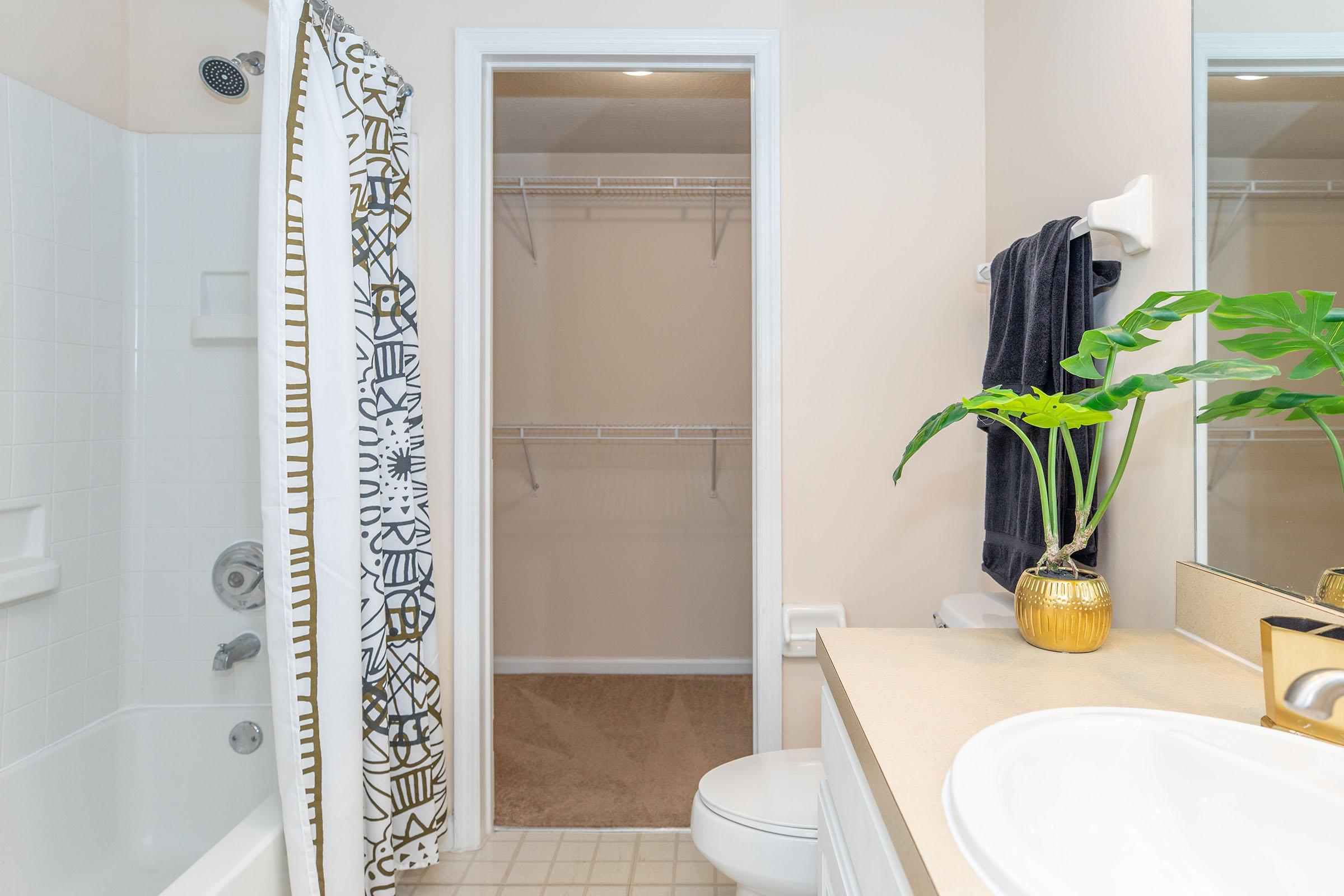 a room with a sink and a shower