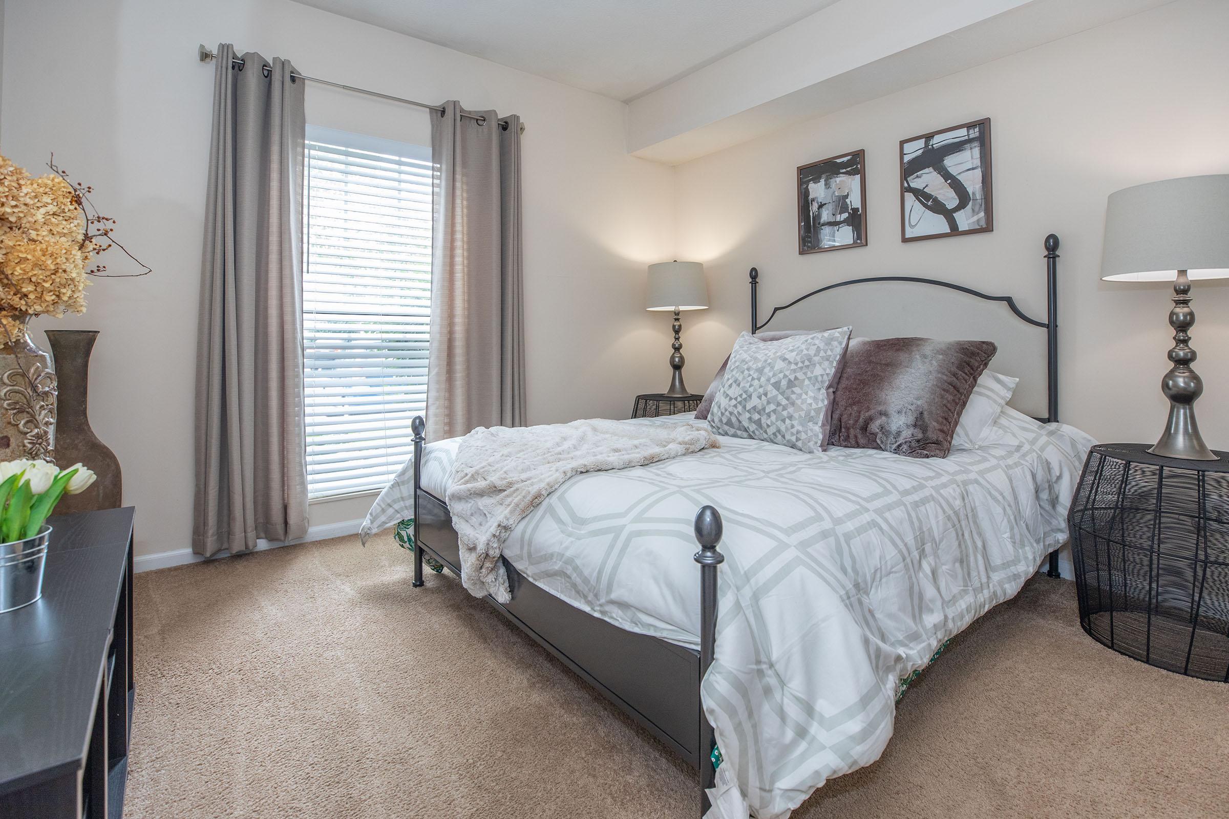 a bedroom with a large bed in a hotel room