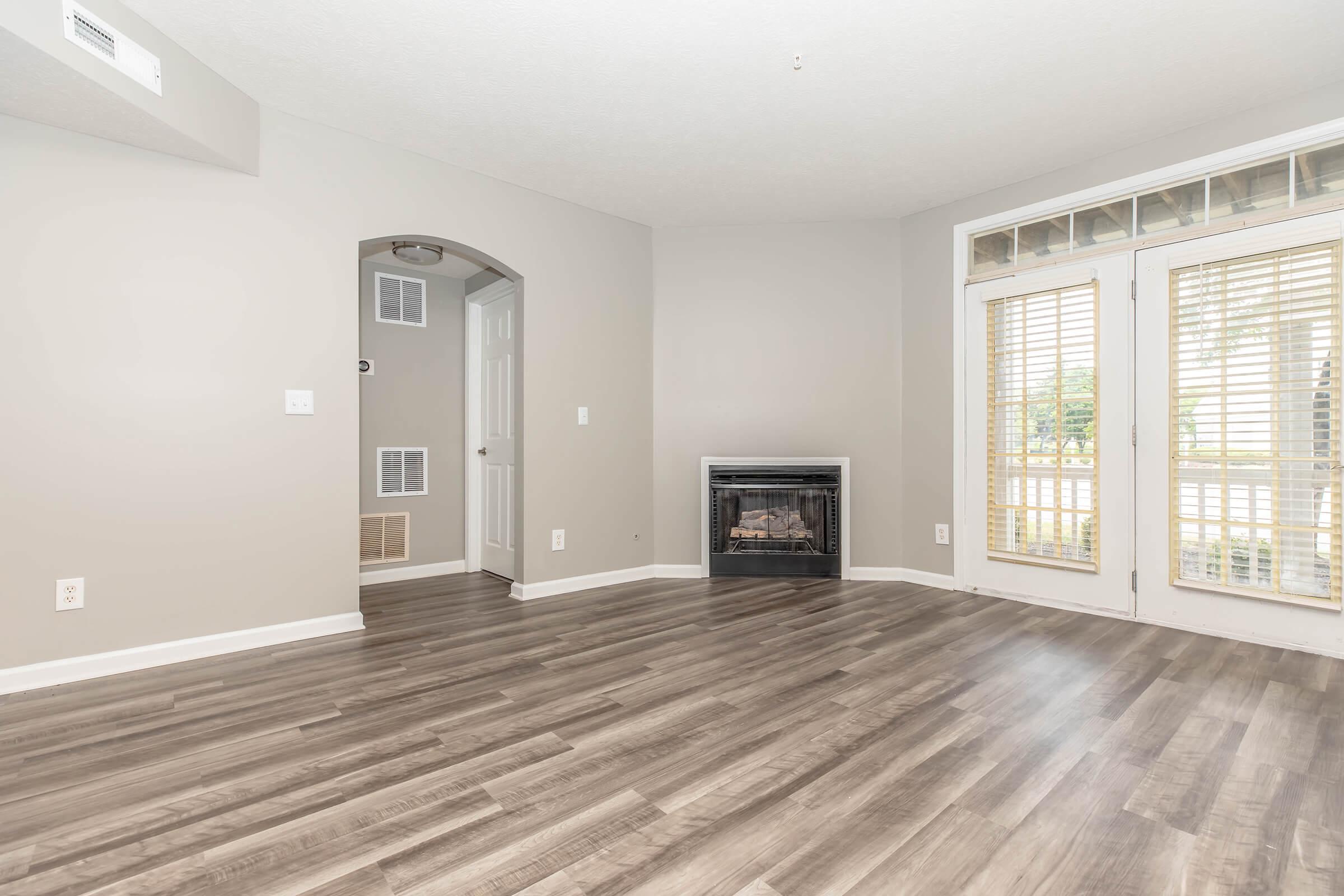 a view of a living room with a large window