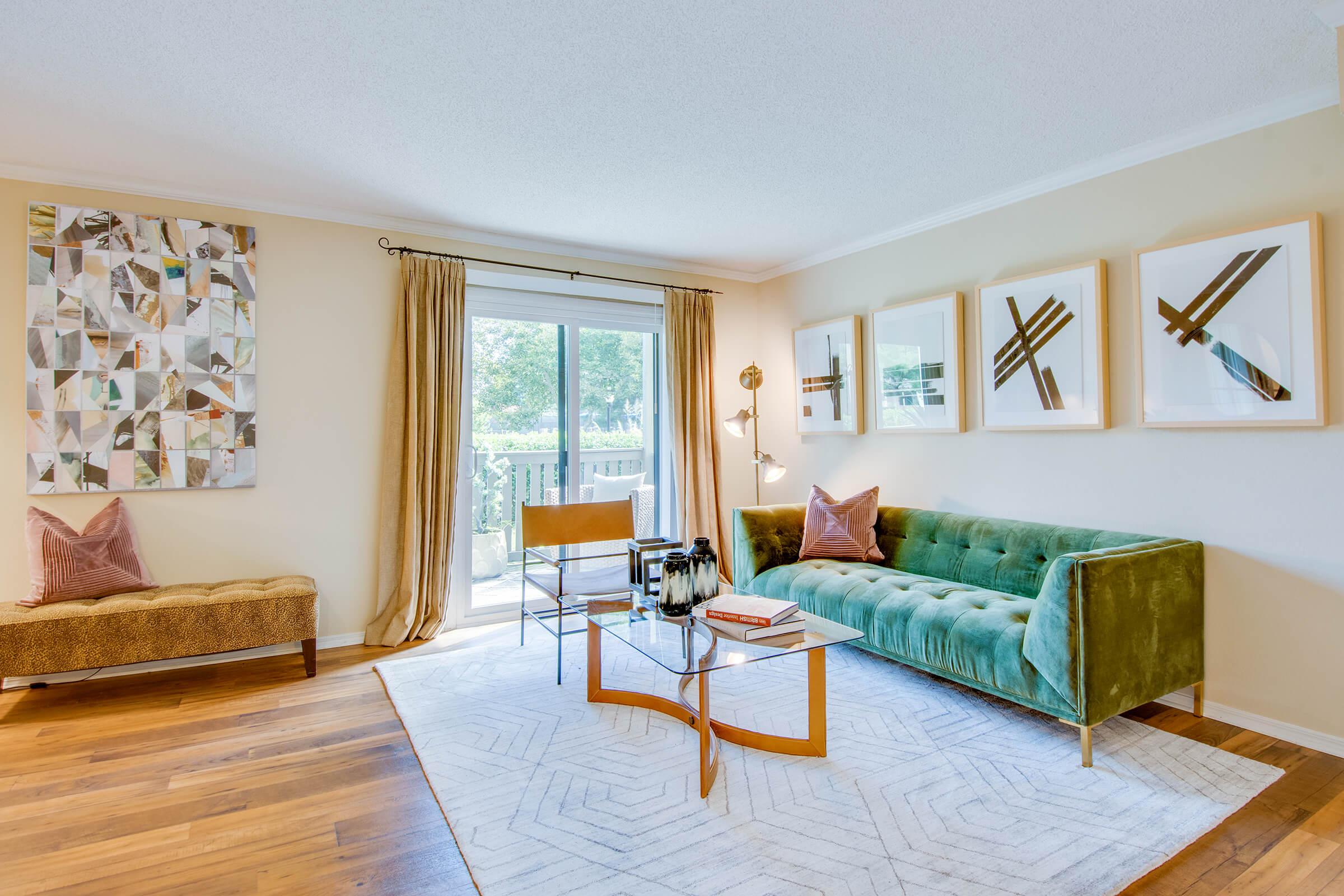 a living room filled with furniture and a bed