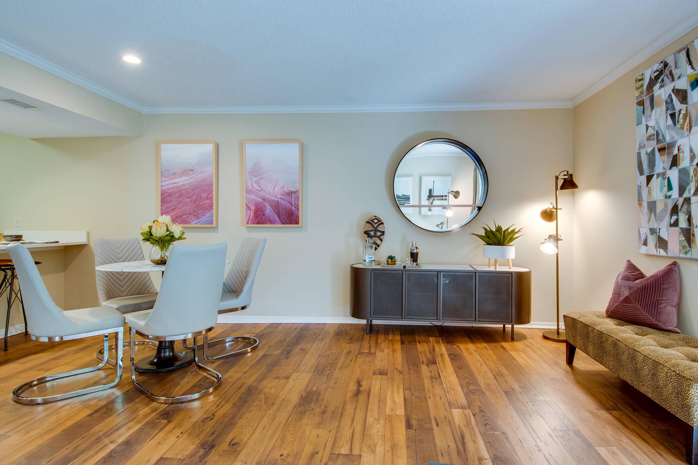 a living room filled with furniture and a flat screen tv