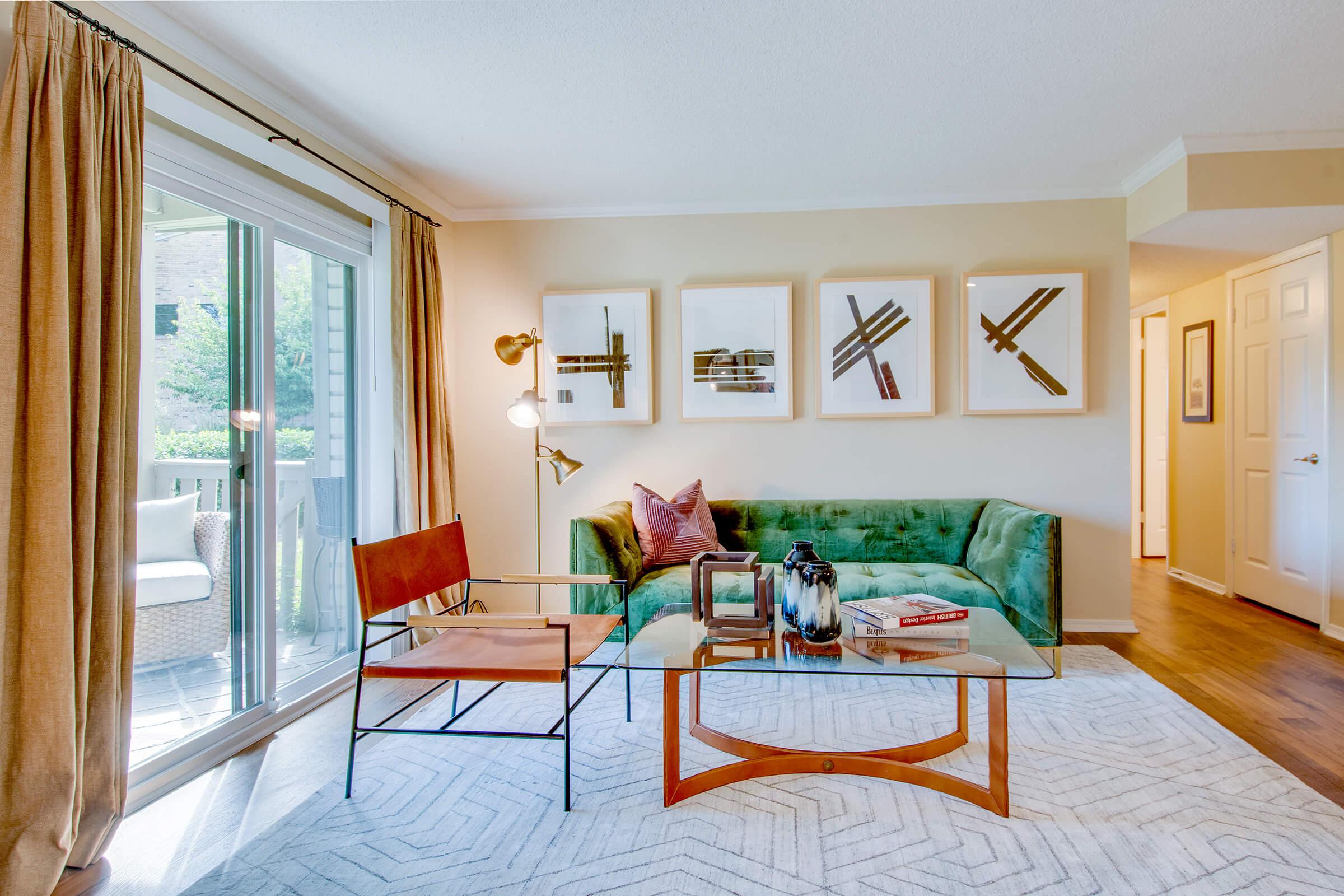 a bedroom with a bed and a chair in a room