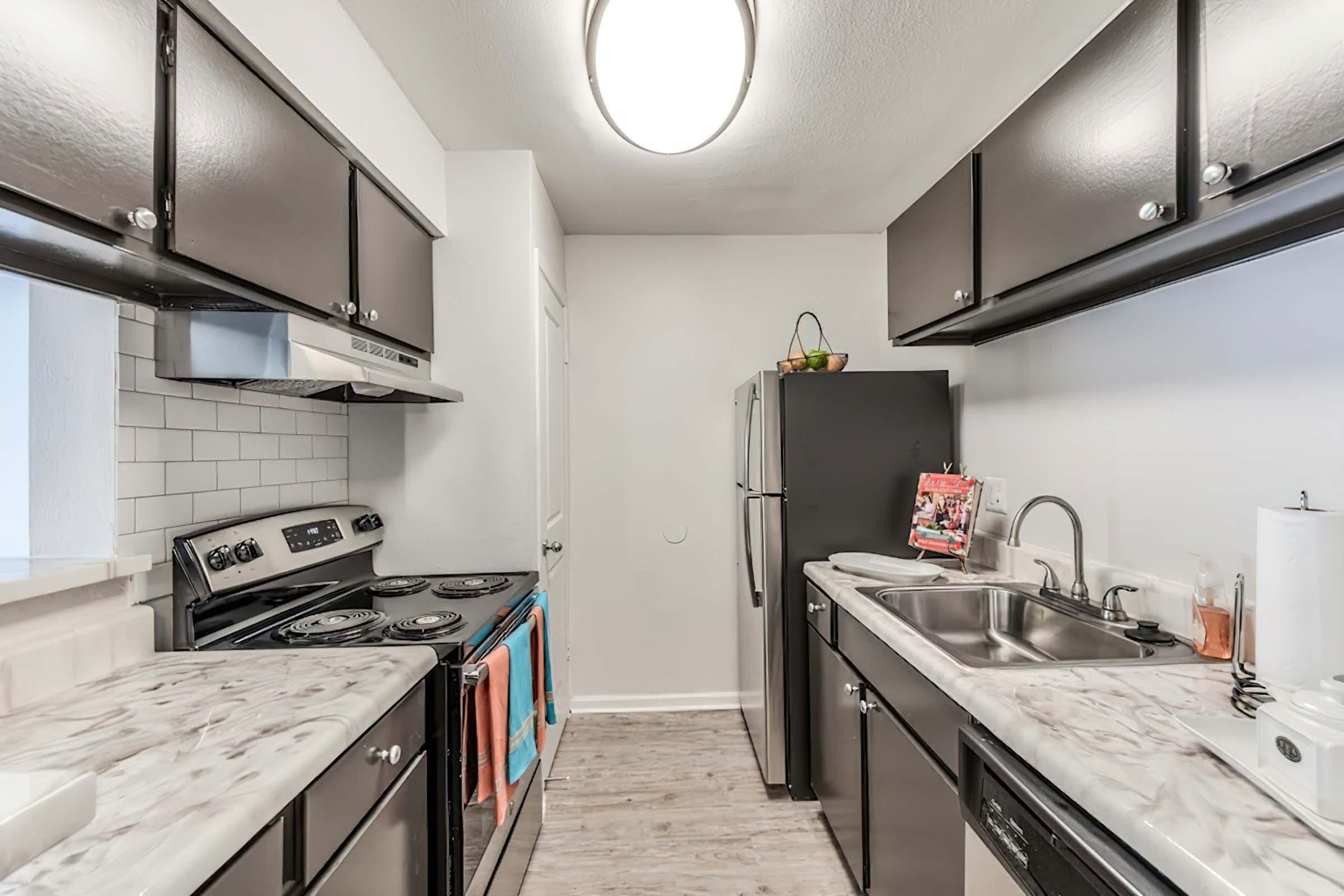 a kitchen with a stove and a sink