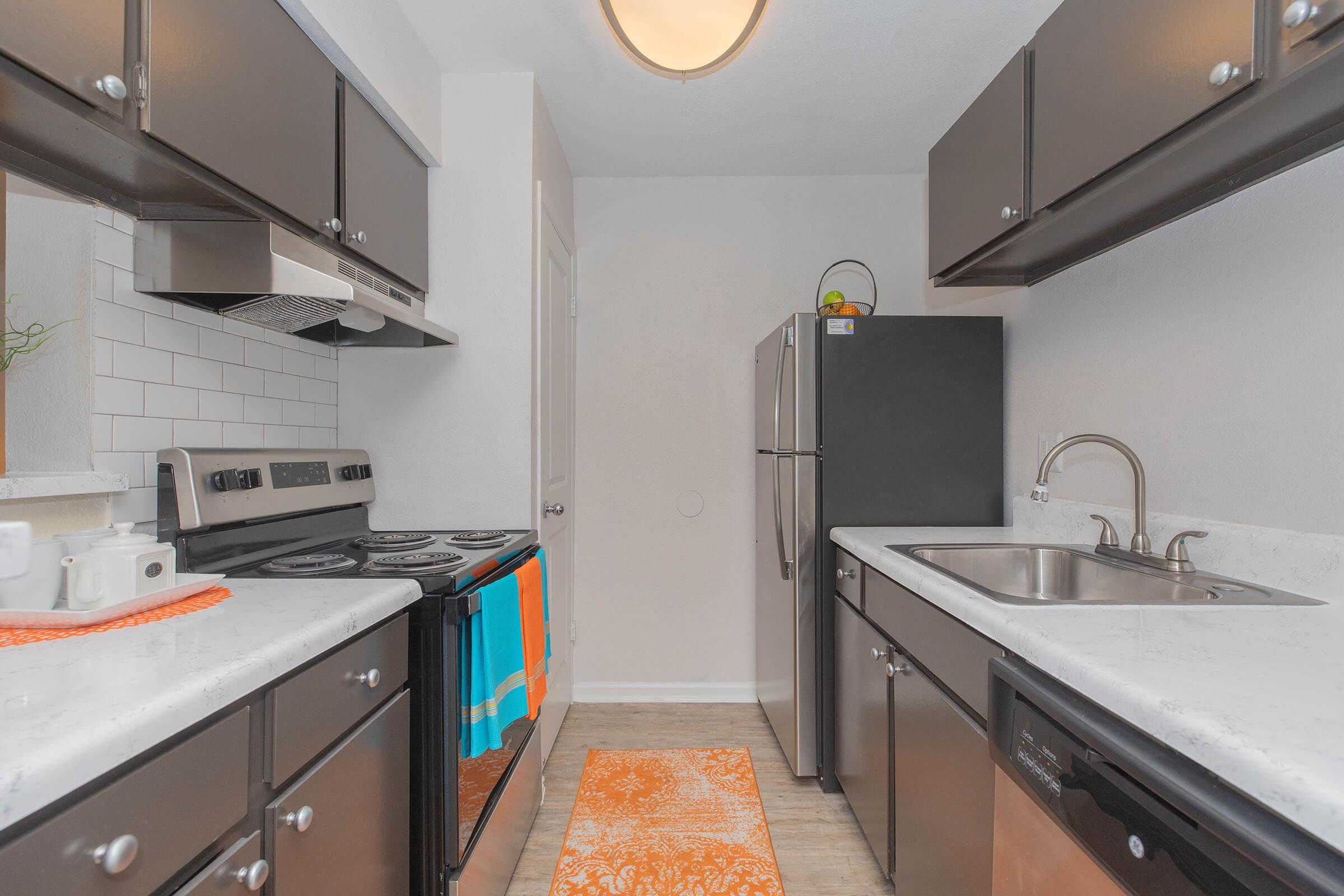 a kitchen with a stove and a sink