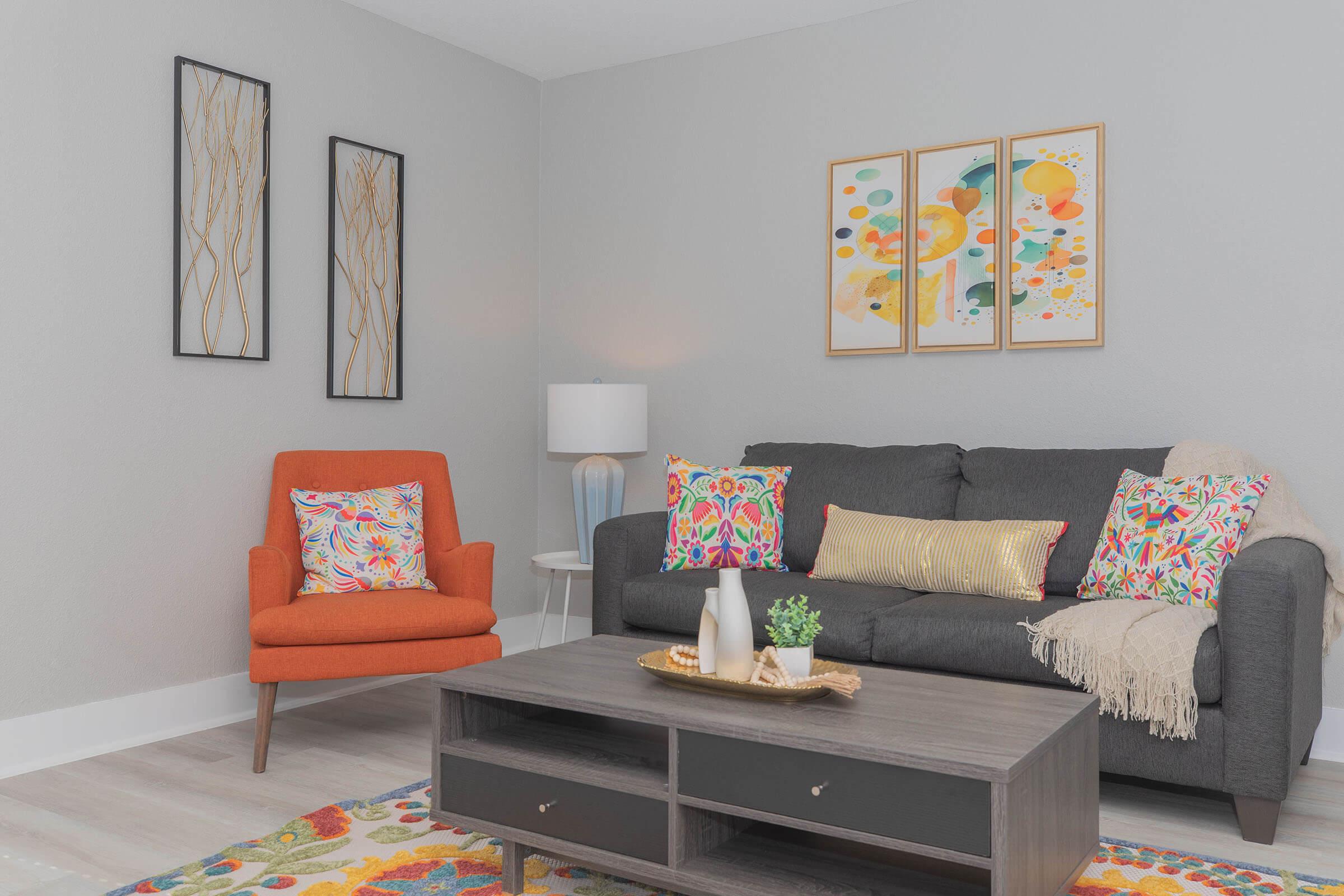 a living room filled with furniture and a fire place