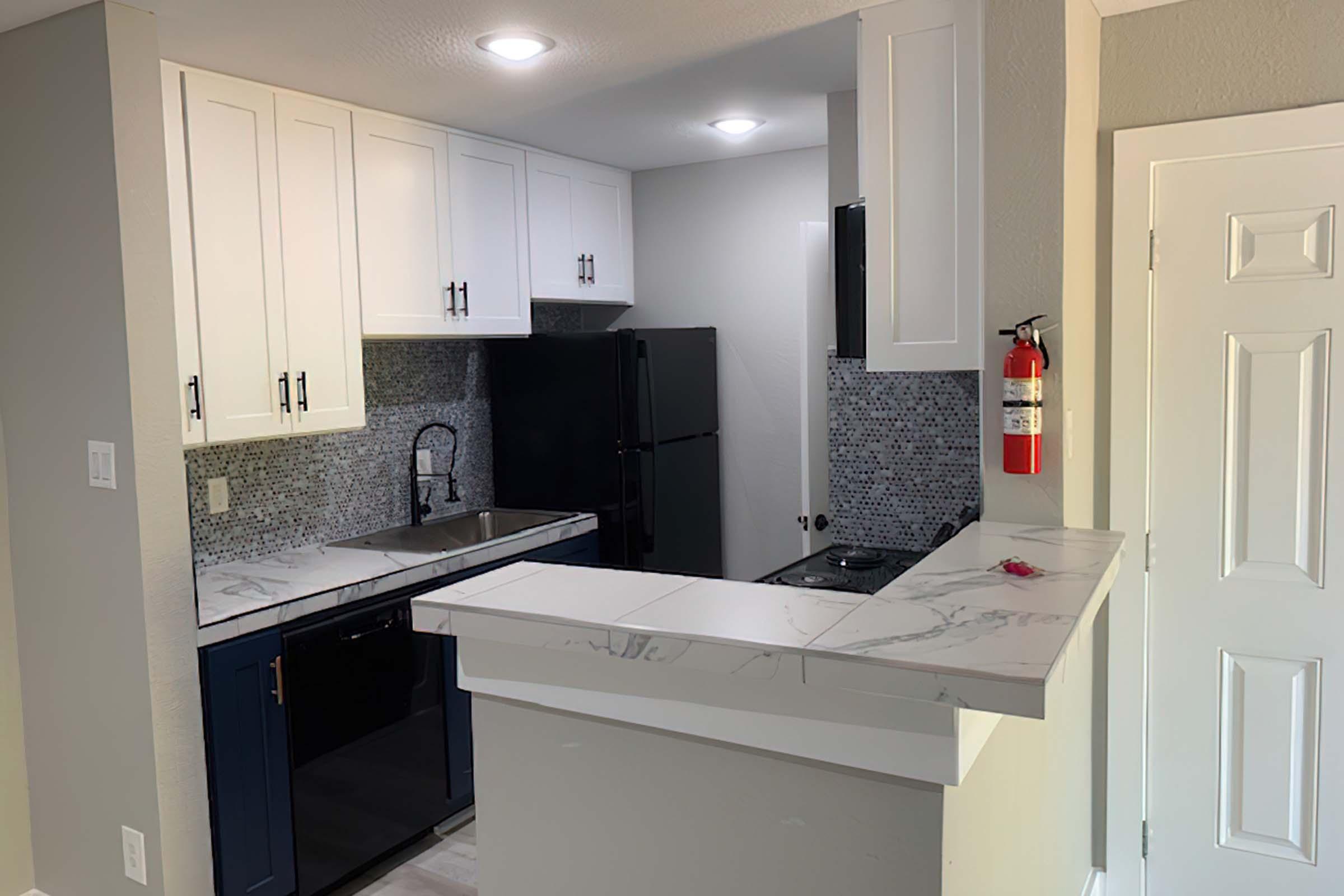 a kitchen with a sink and a microwave