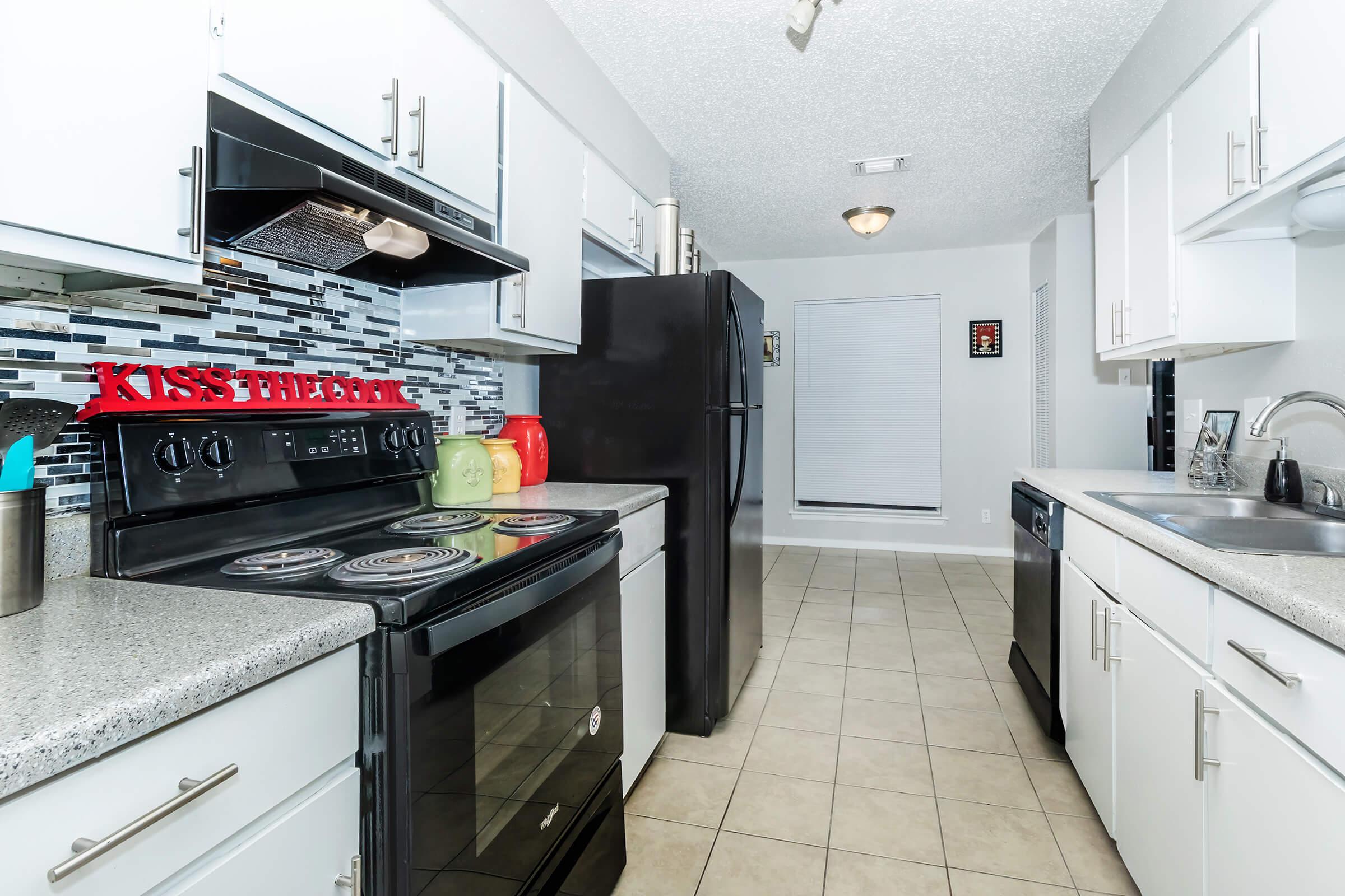 a large kitchen with stainless steel appliances