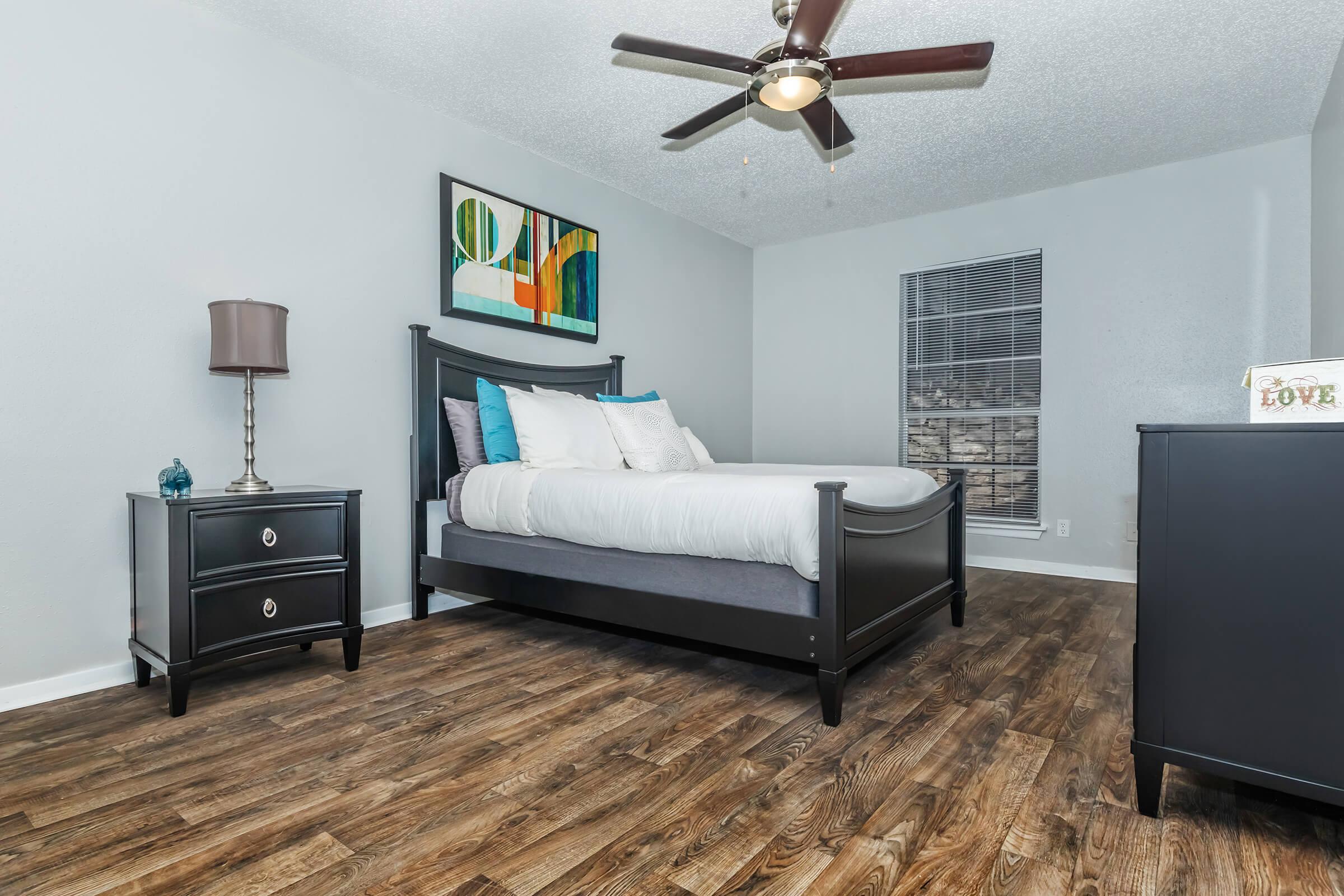 a living room filled with furniture and a flat screen tv