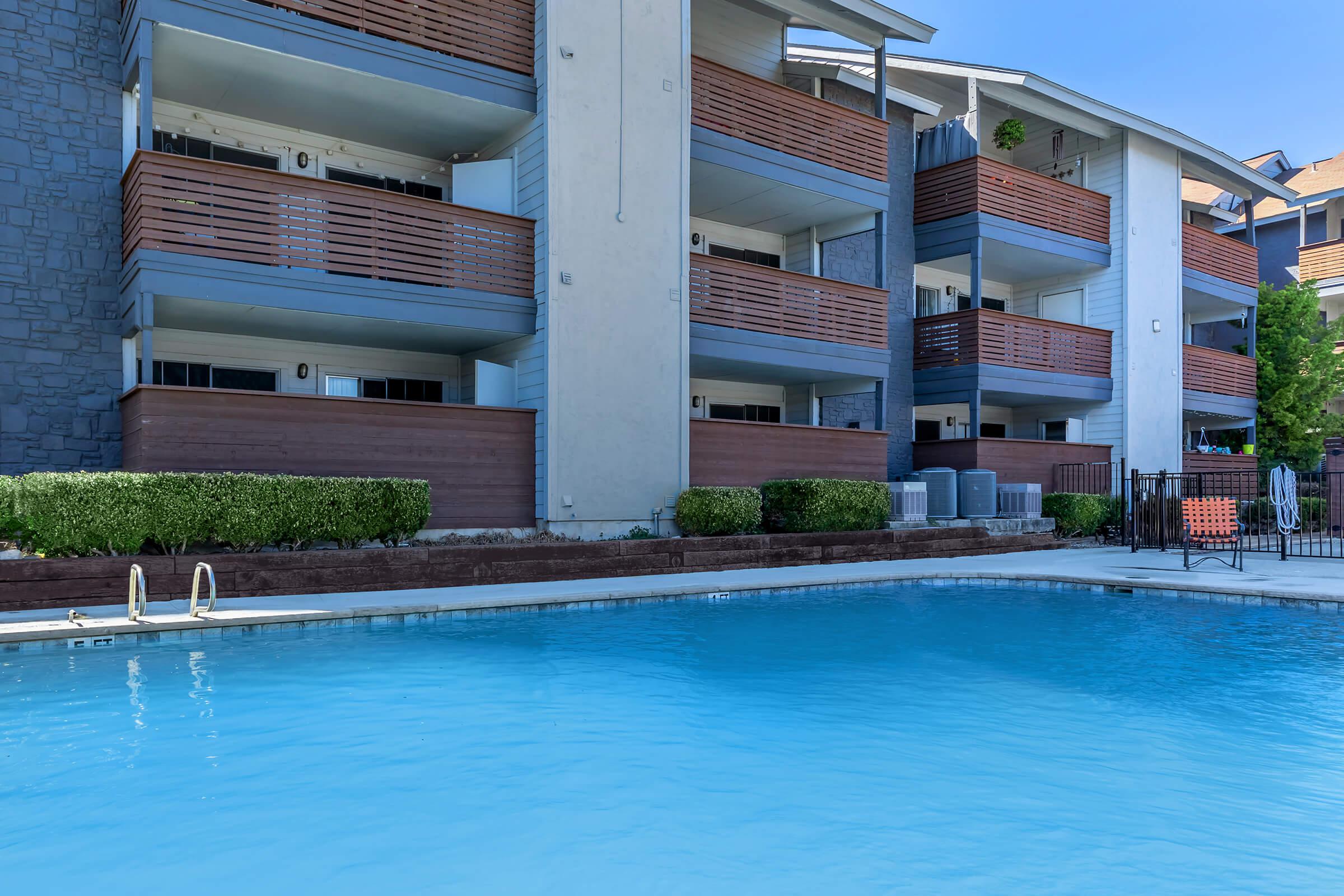 a pool next to a body of water