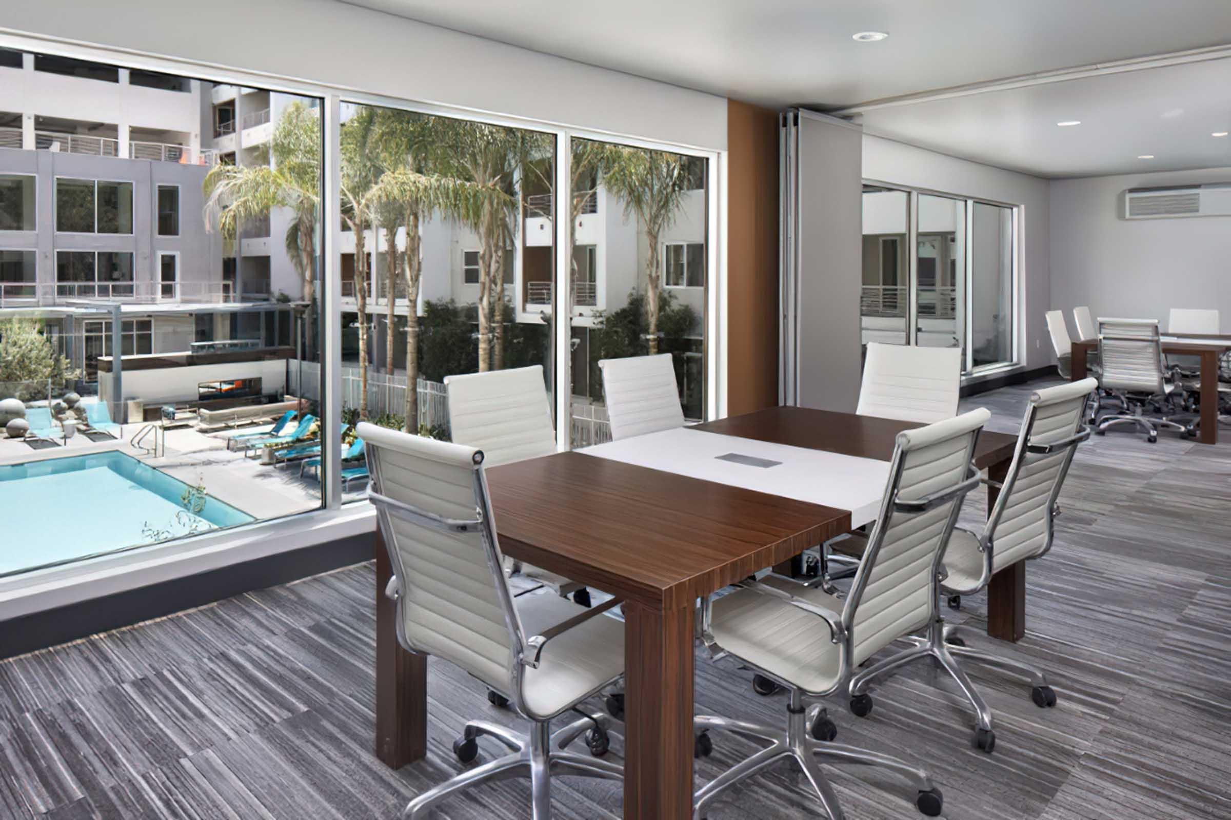 a conference table in front of a window