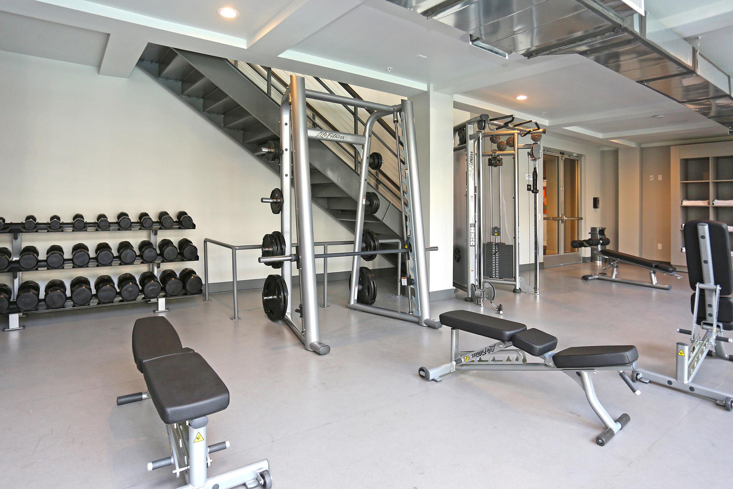 a gym with weight equipment