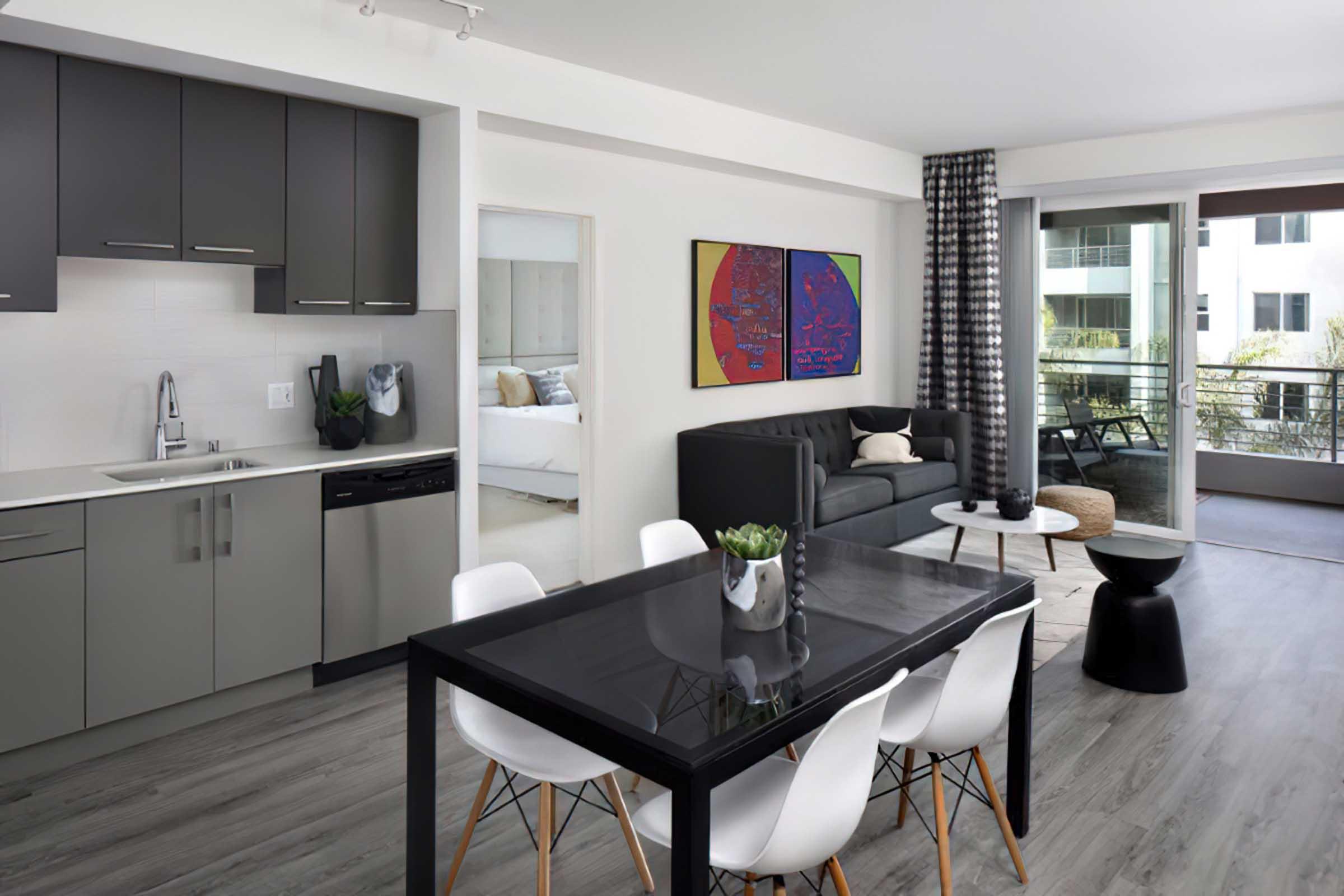 a kitchen with an table in the middle of a room