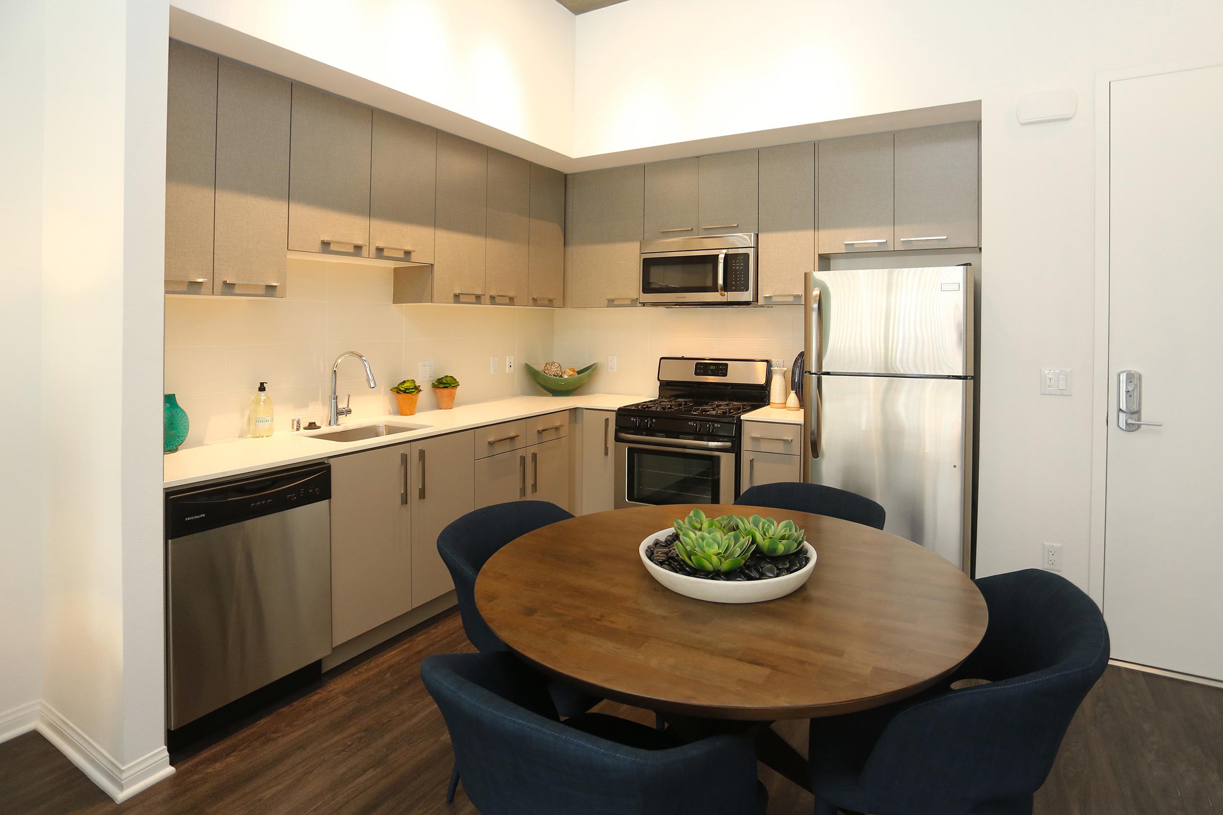 a modern kitchen with stainless steel appliances