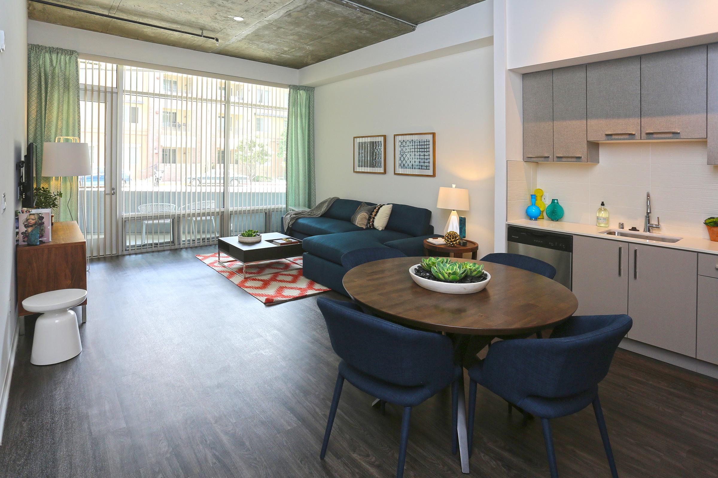 a kitchen with a dining table and chairs