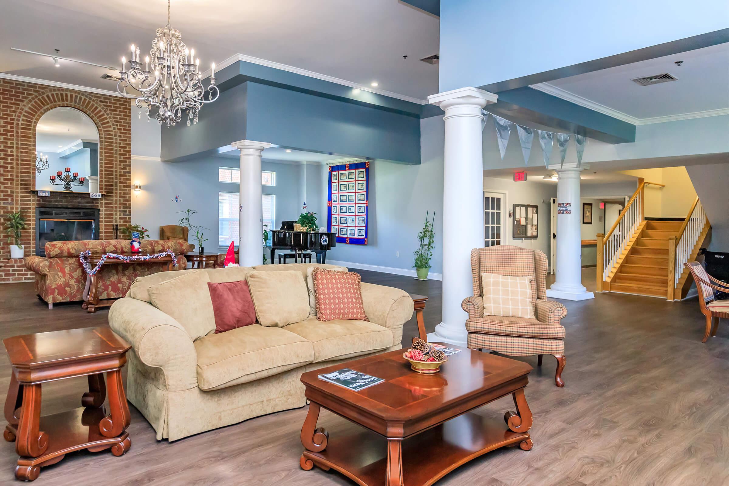 a living room filled with furniture and a fireplace