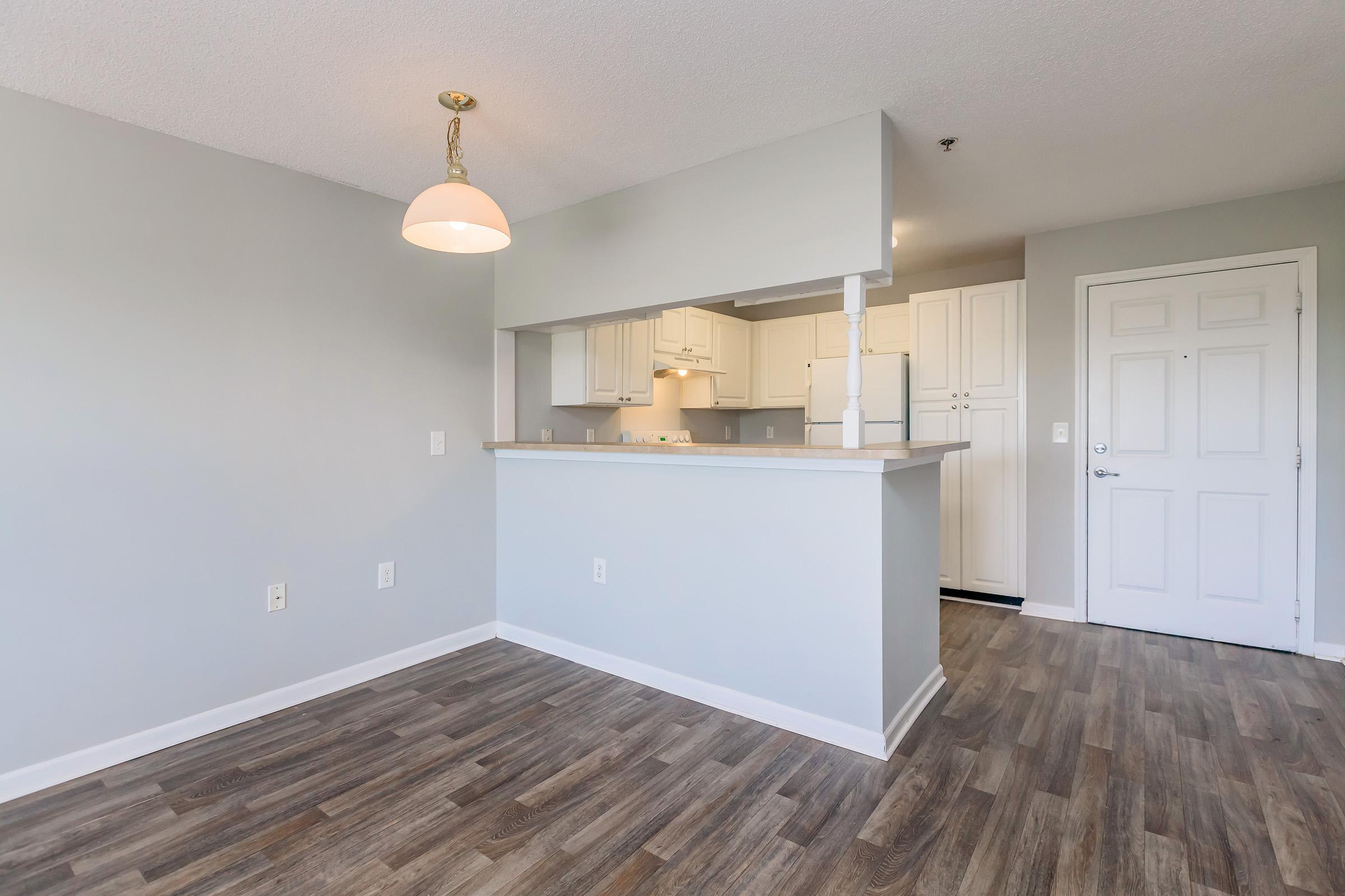 a kitchen with a wood floor