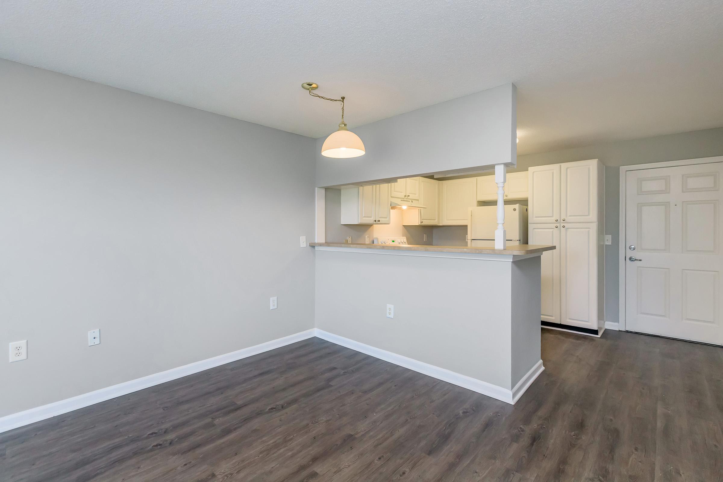 a kitchen with a wood floor