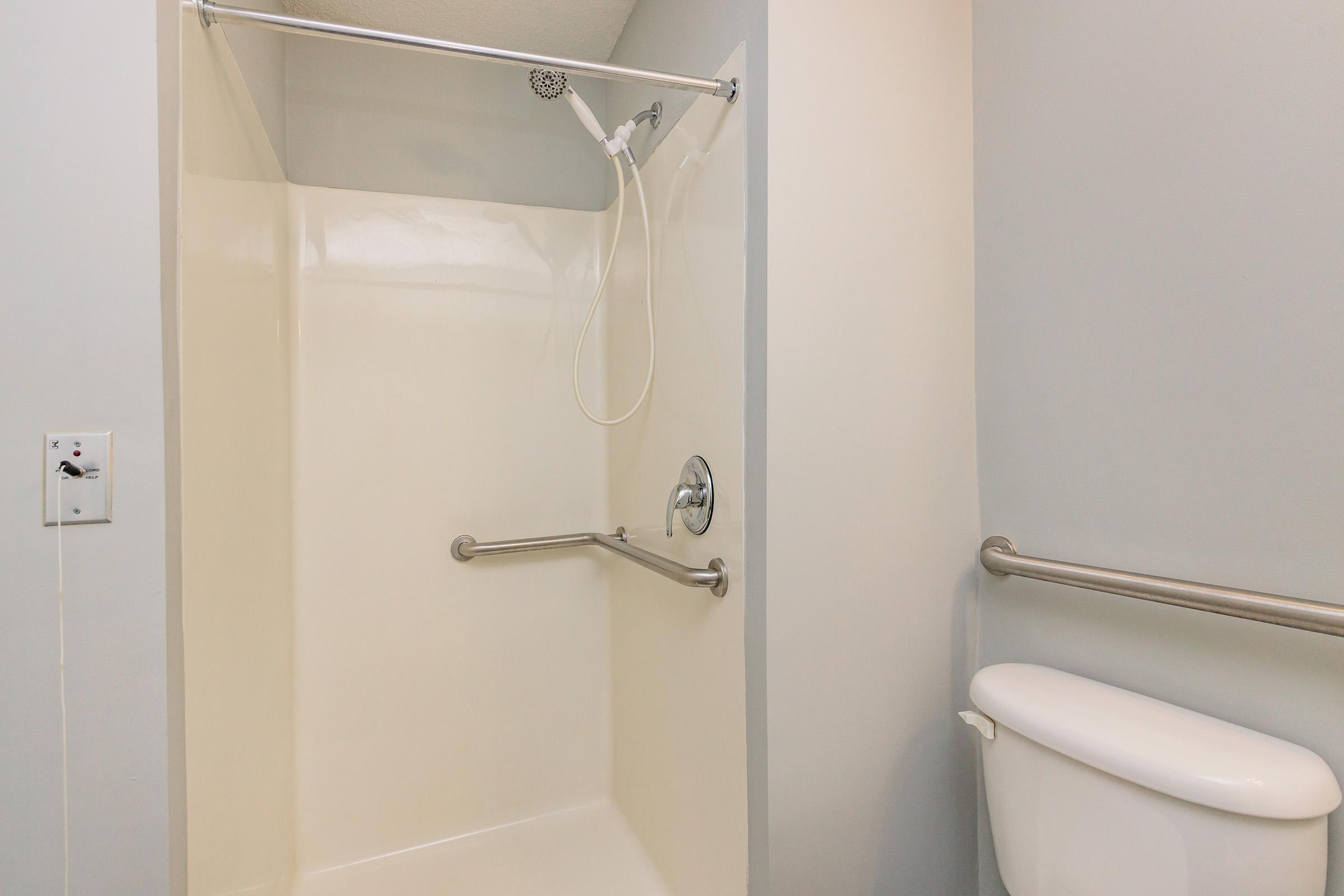 a close up of a shower in a small room