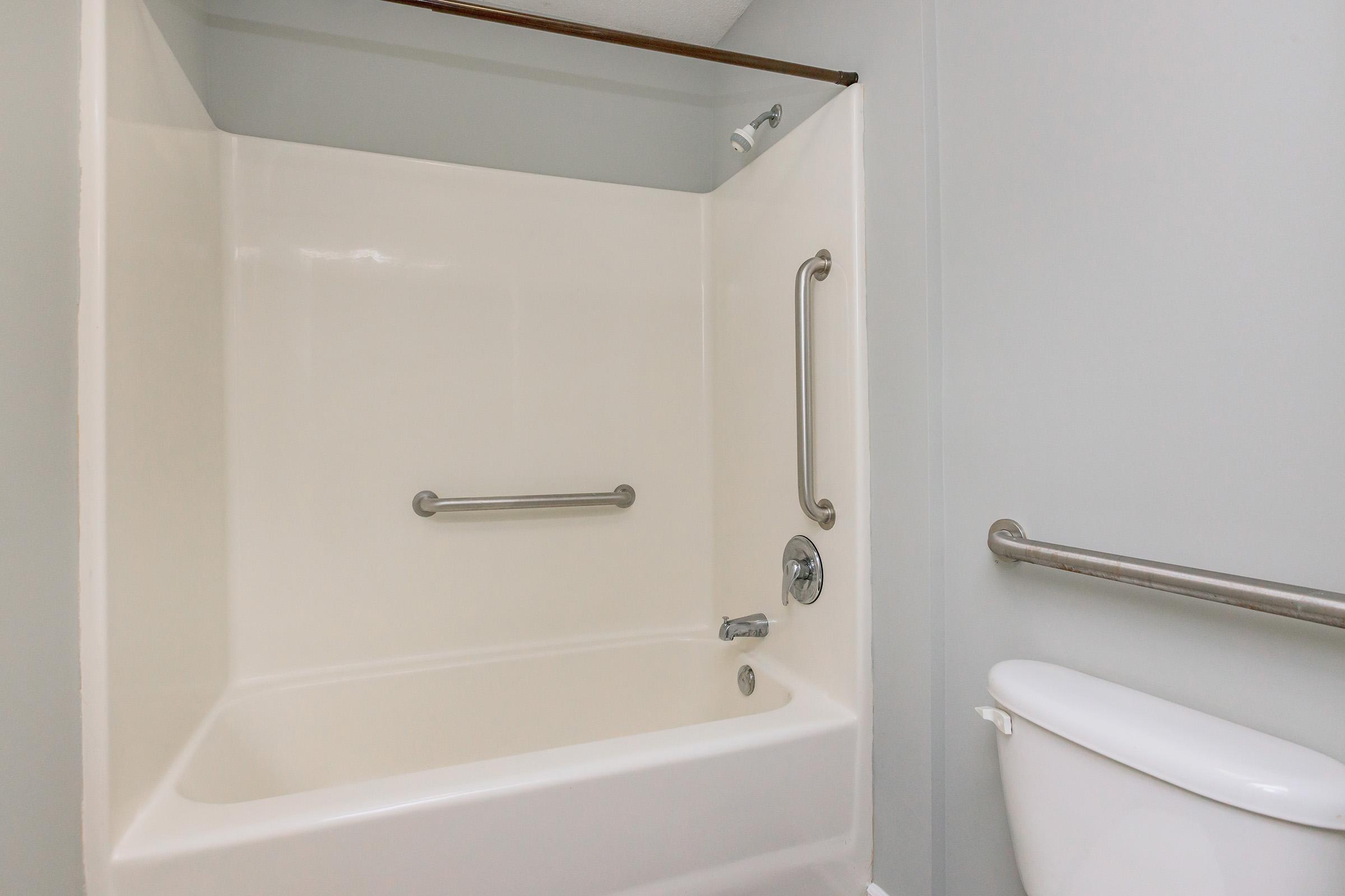 a close up of a sink and a shower