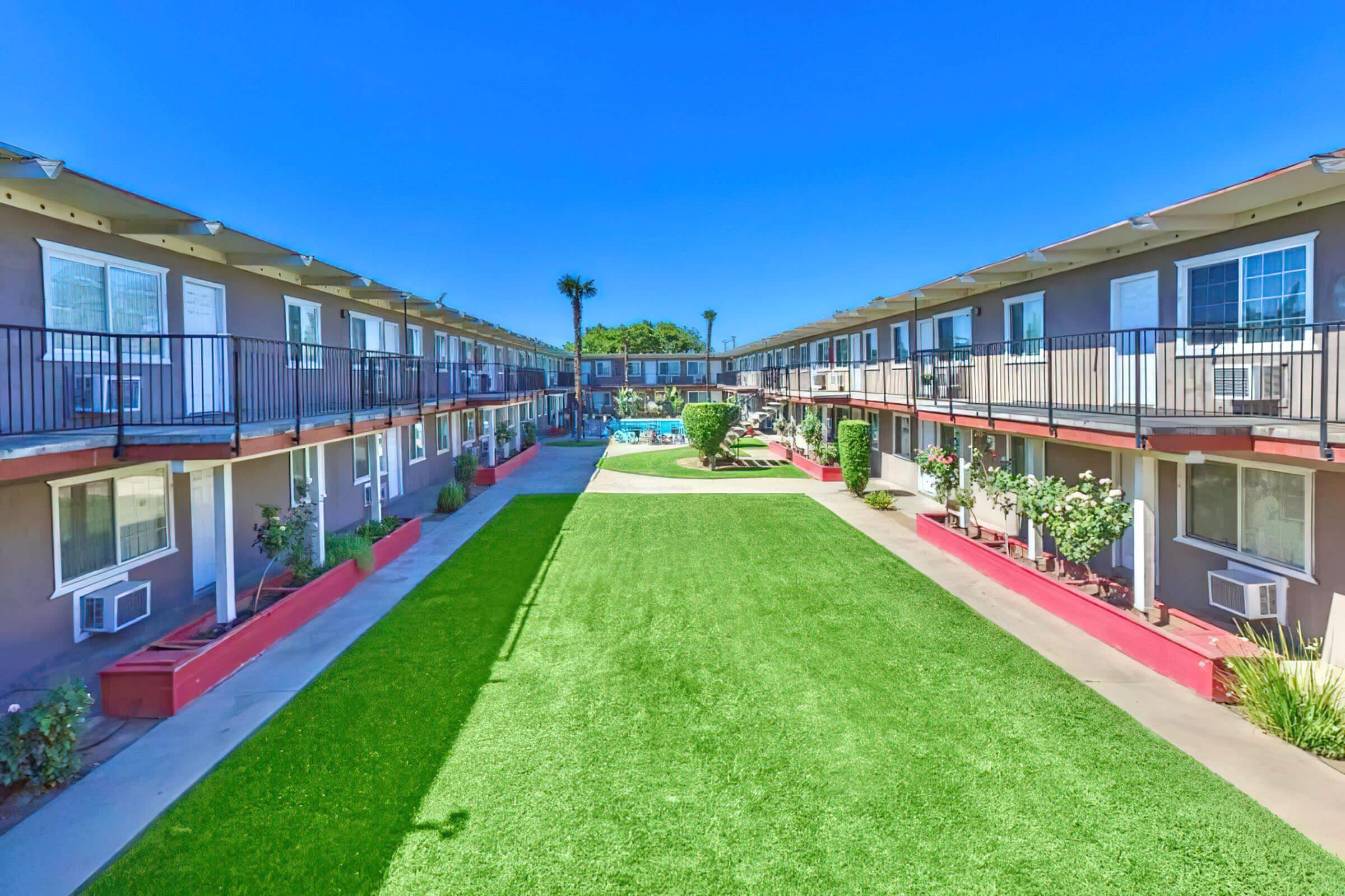 a large lawn in front of a building