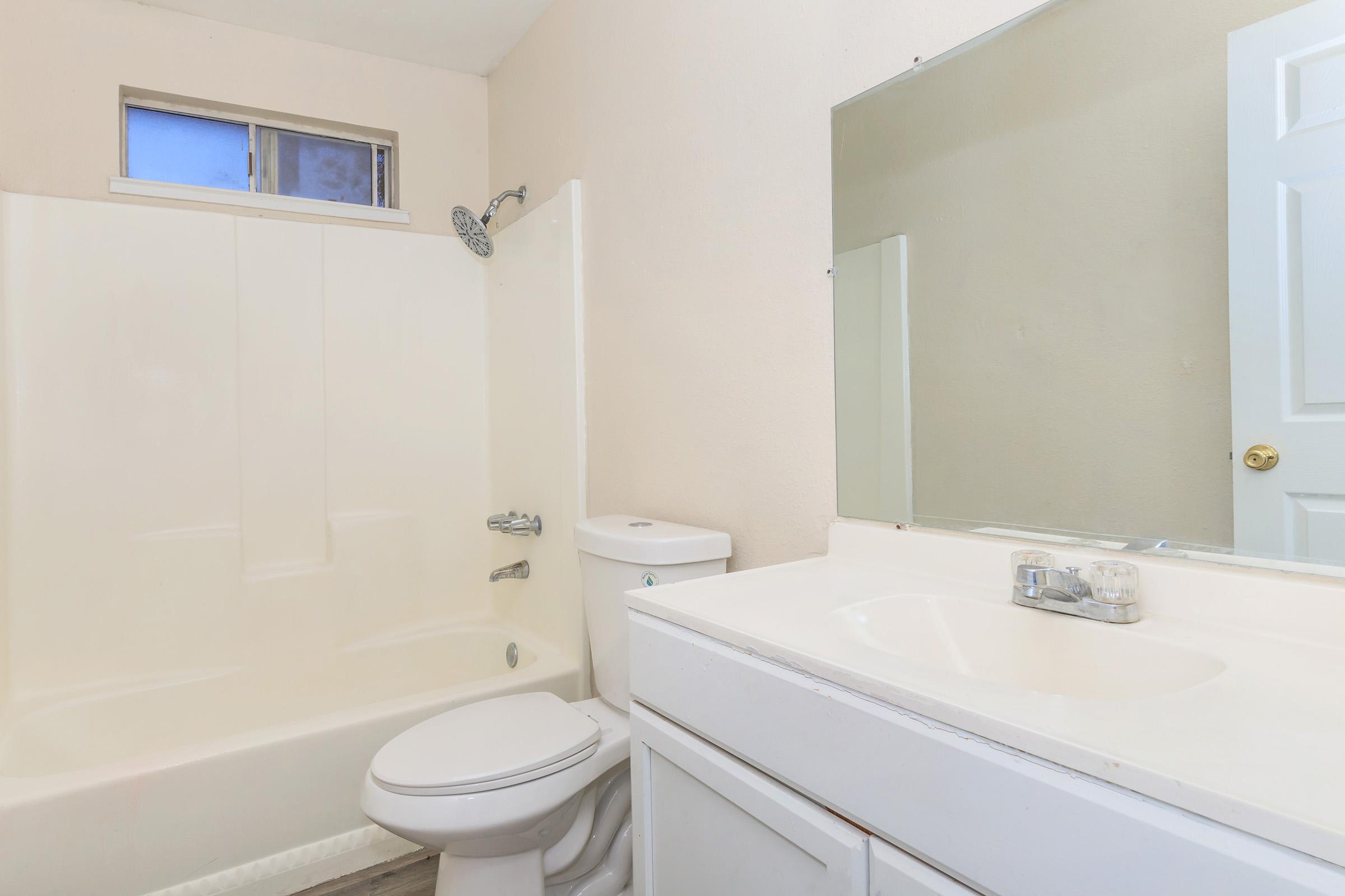 a room with a sink and a shower