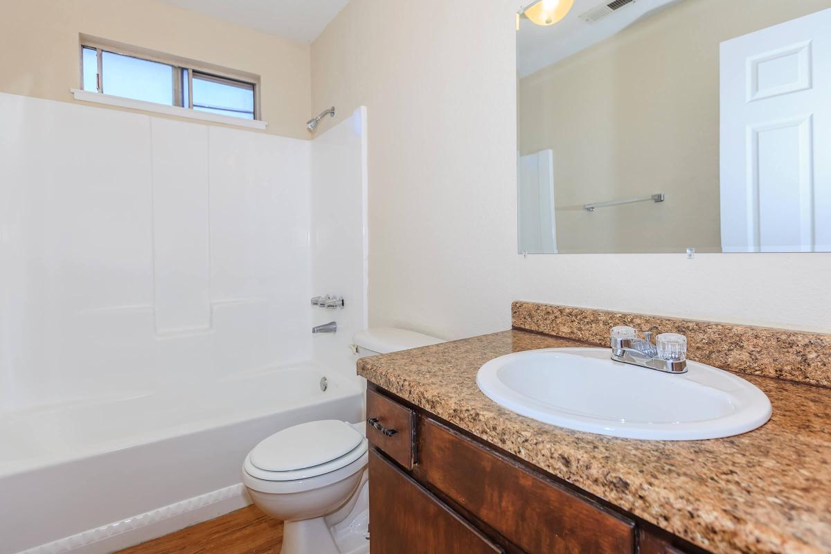 a room with a sink and a mirror