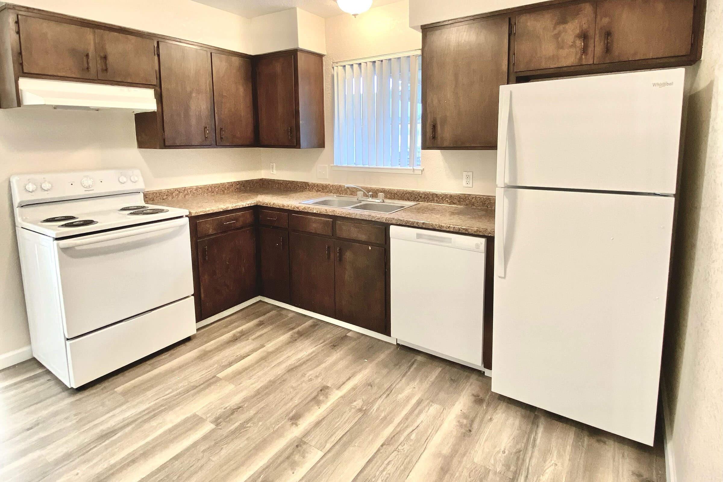 a kitchen with a wood floor